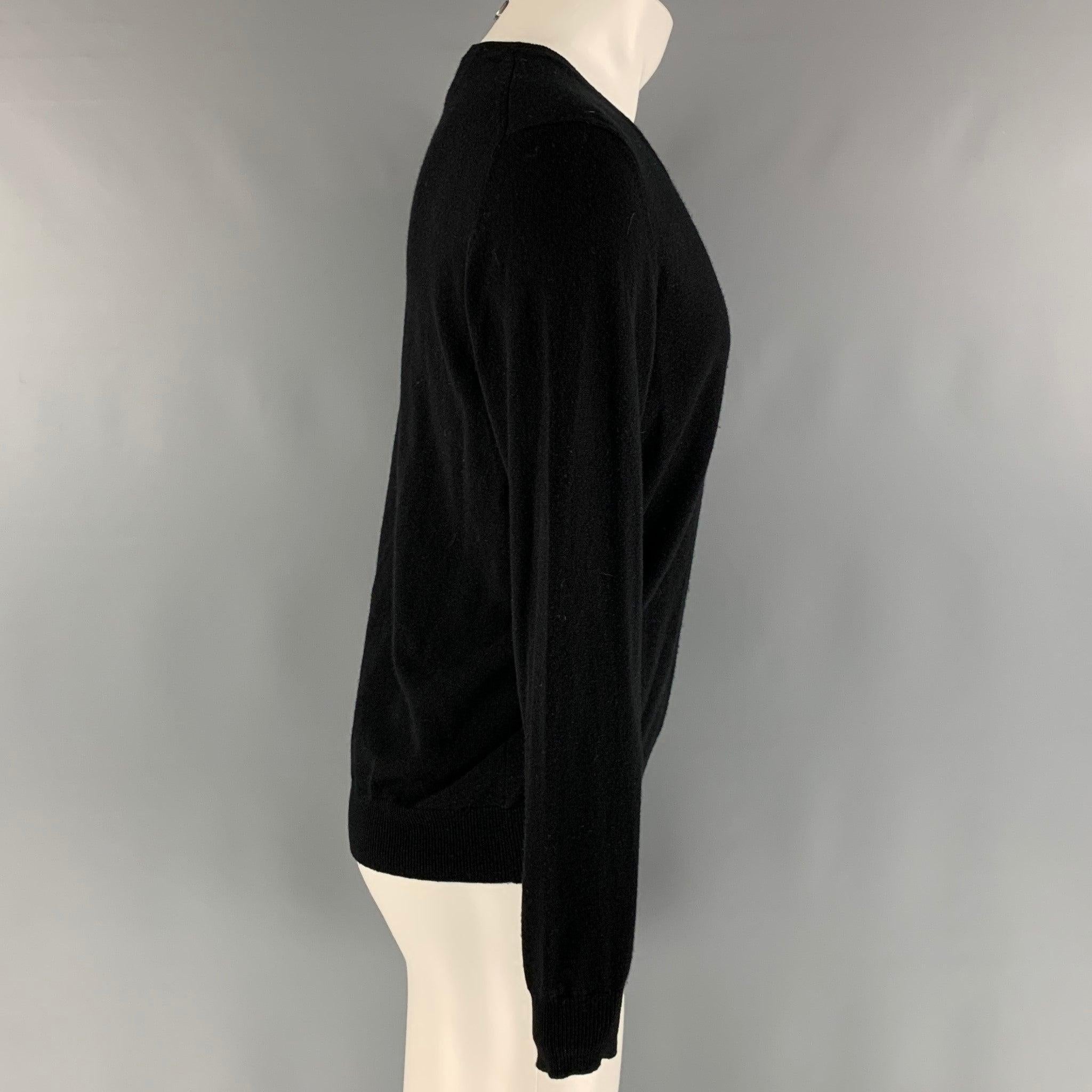 SAKS FIFTH AVENUE pullover comes in a black cashmere knit featuring a V-neck.Good Pre-Owned Condition. Moderate signs of wear and piling. 

Marked:   M 

Measurements: 
 
Shoulder: 17 inches Chest: 46 inches Sleeve: 25.5 inches Length: 26 inches  

