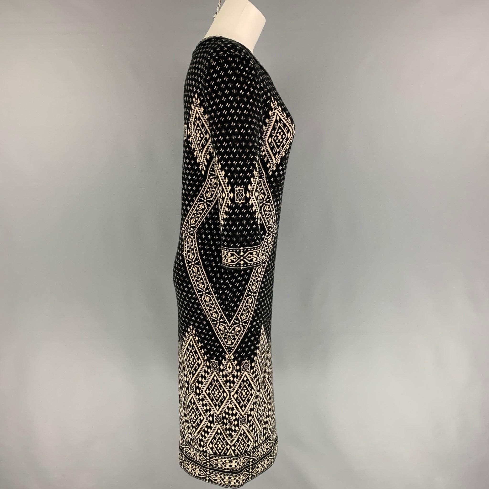 SAKS FIFTH AVENUE dress comes in a black & white print cotton blend featuring a wide neckline and 3/4 sleeves.
Very Good
Pre-Owned Condition. 

Marked:   M  

Measurements: 
 
Shoulder: 16.5 inches  Bust: 34 inches  Waist: 30 inches  Hip: 34 inches 