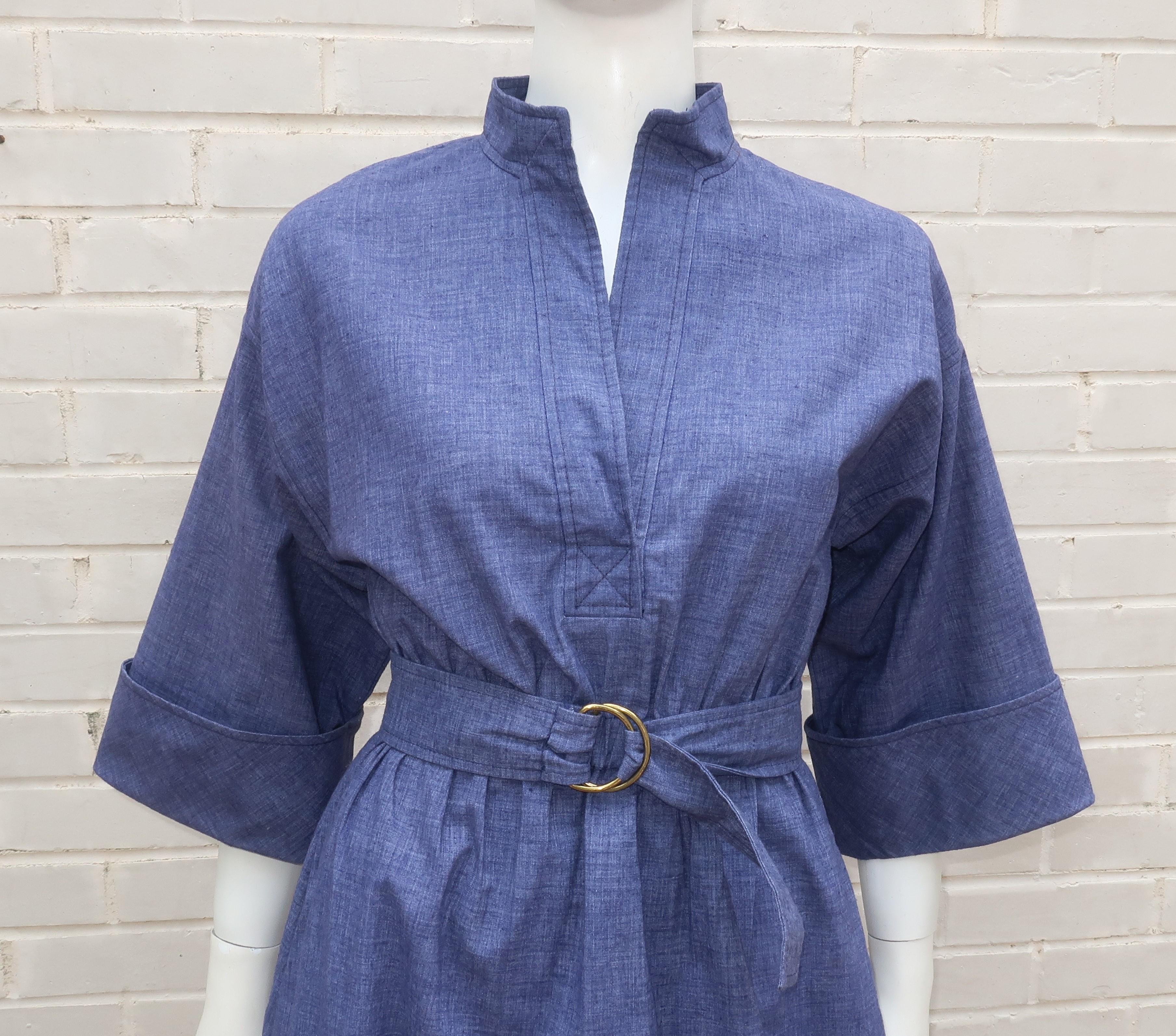 1970’s Saks Fifth Avenue Young Dimensions denim dress with coordinating belt.  The dress is a simple pullover construction with an elasticized waist, tab style collar, side pockets and modified bell sleeves.  A casual chic look with a nod to