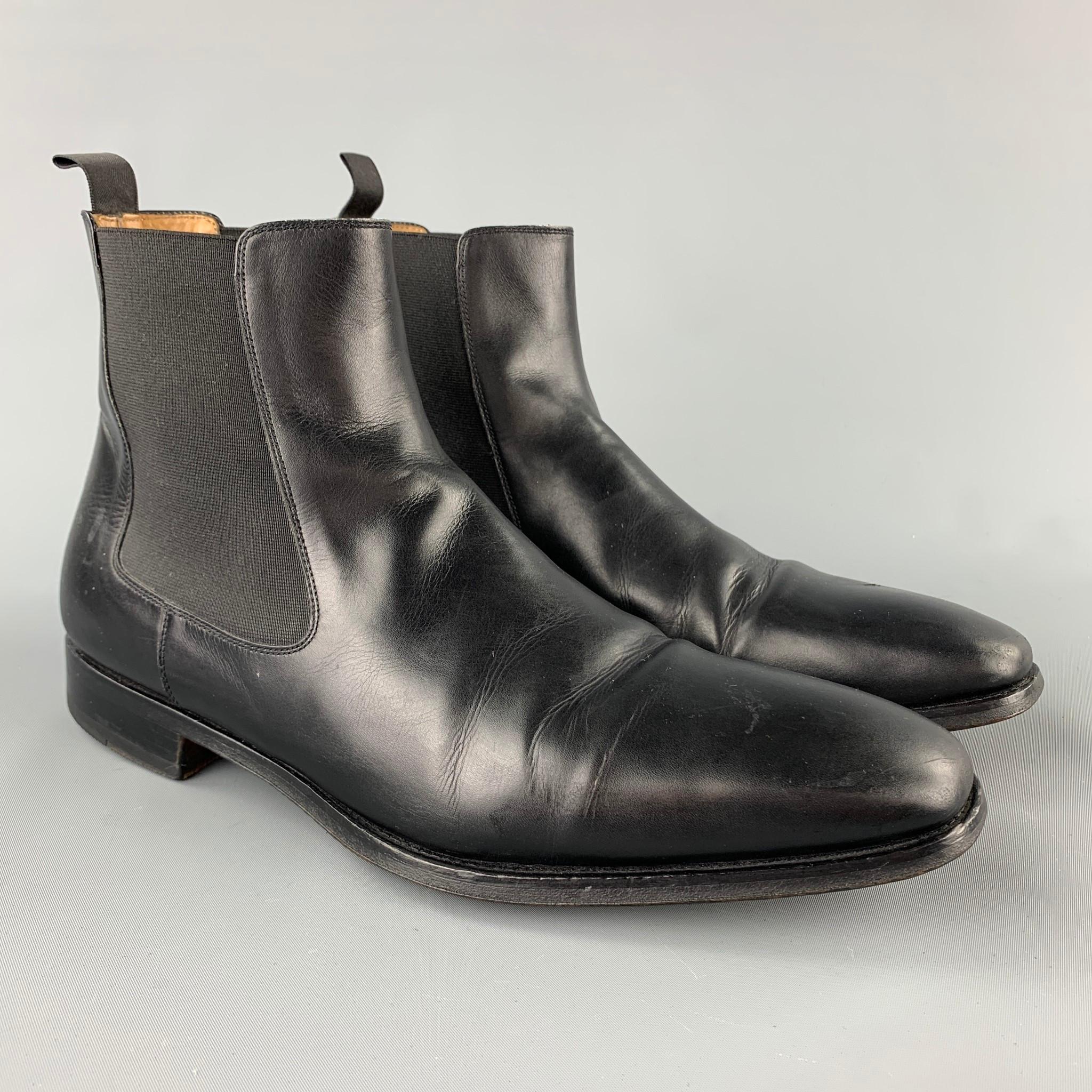 SAKS FIFTH AVENUE by MAGNANNI boots comes in a black leather featuring a pull on style, cap toe, and a wooden sole. Made in Spain.

Good Pre-Owned Condition.
Marked:12795 10.5 M

Measurement 

Length: 12 in.
Width: 4 in.
Height: 3 in. 