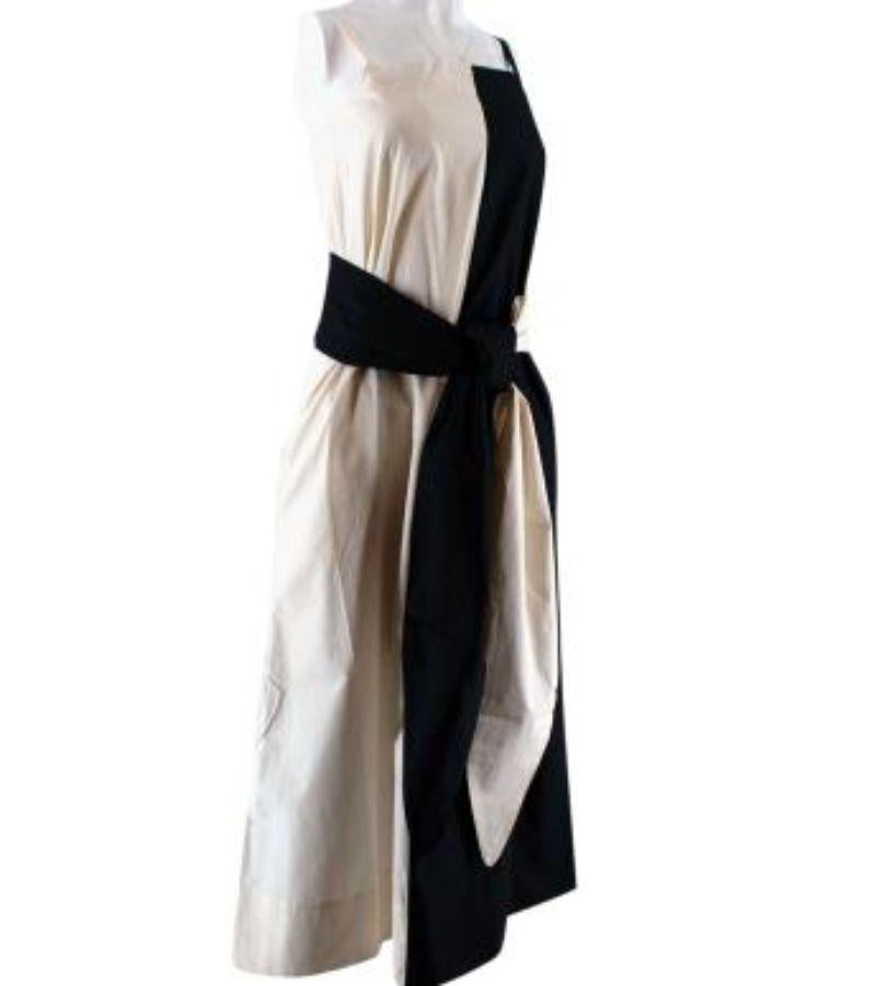 Saks Potts Black & Cream Cotton Caroline Dress with Wrap Belt

- Organic cotton two-tone midi dress with wrap belt 
- Embroidered chest logo
- Straight neckline 
- Adjustable thin straps 
- Unlined 

Made in China 
100% organic cotton 
Machine wash