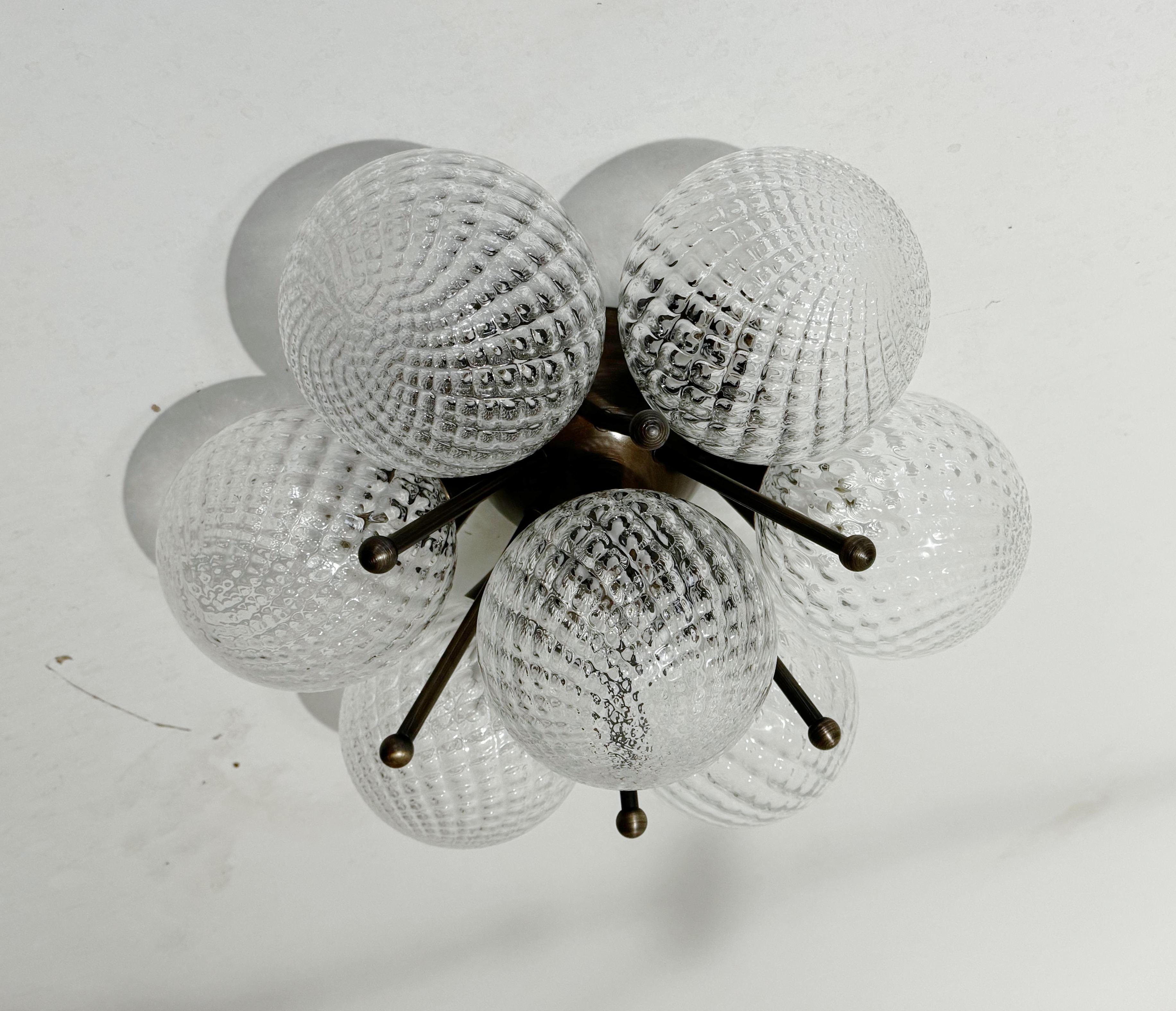 Italian flush mount with textured balloton Murano glass globes mounted on solid brass frame
Designed by Fabio Bergomi / Made in Italy
7 lights / E12 or E14 type / max 40W each
Diameter: 22 inches / Height: 11 inches
Order only / This item ships from