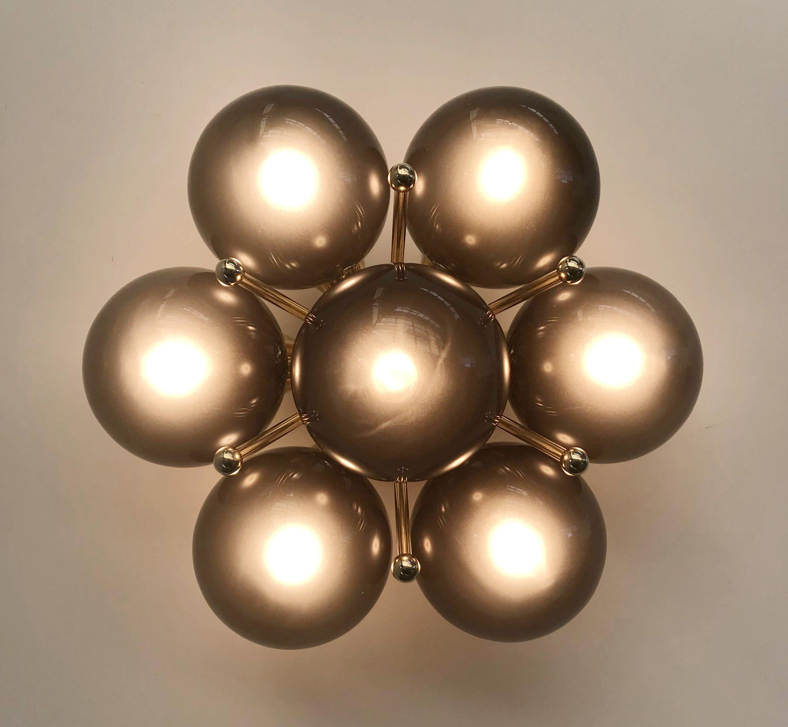 Italian flush mount with Murano glass globes mounted on solid brass frame
Designed by Fabio Bergomi / Made in Italy
7 lights / E12 or E14 type / max 40W each
Diameter: 22 inches / Height: 11 inches
Order only / This item ships from Italy
Order