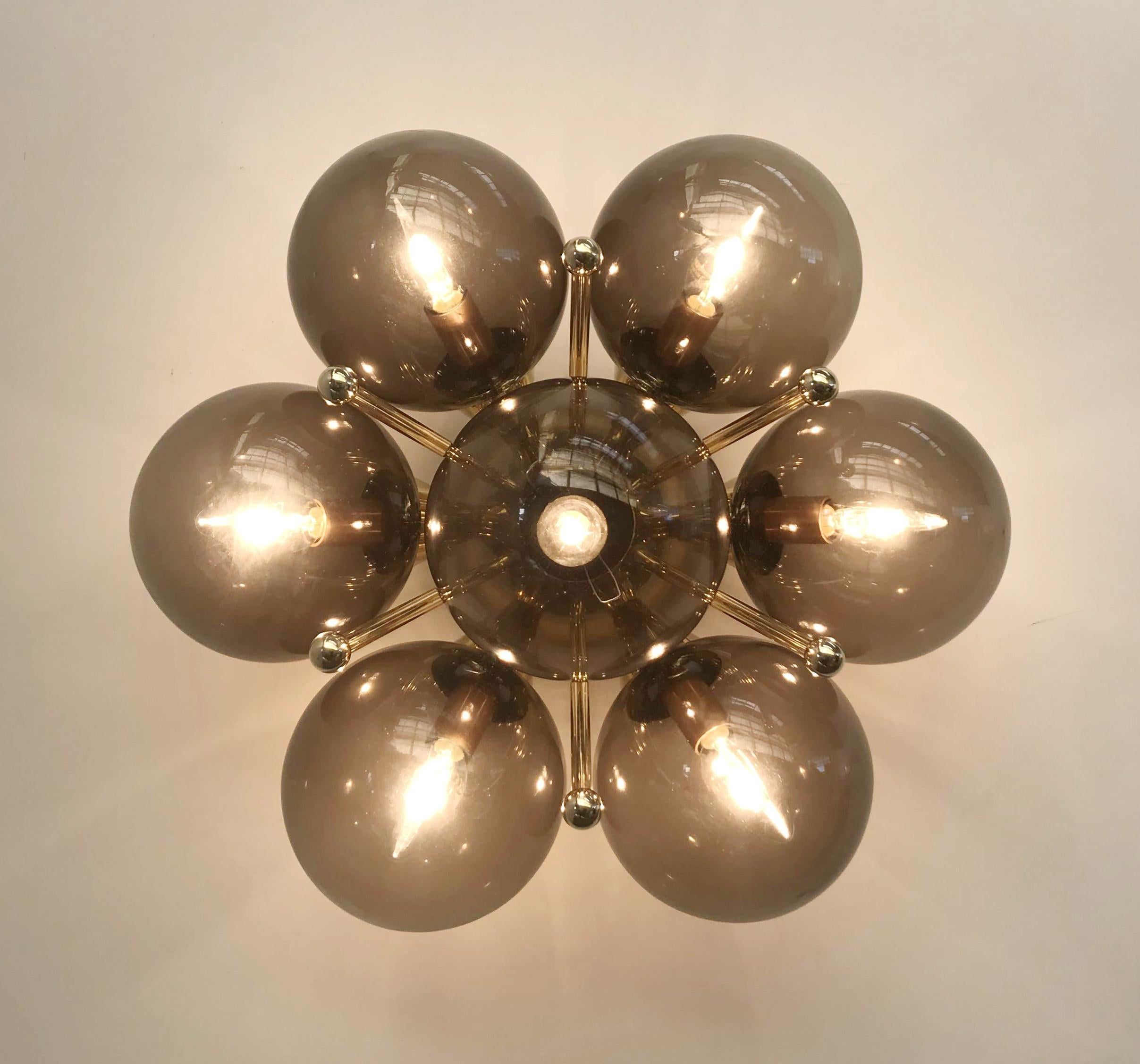 Italian flush mount with Murano glass globes mounted on solid brass frame
Designed by Fabio Bergomi / Made in Italy
7 lights / E12 or E14 type / max 40W each
Diameter: 22 inches / Height: 11 inches
Order only / This item ships from Italy
Order