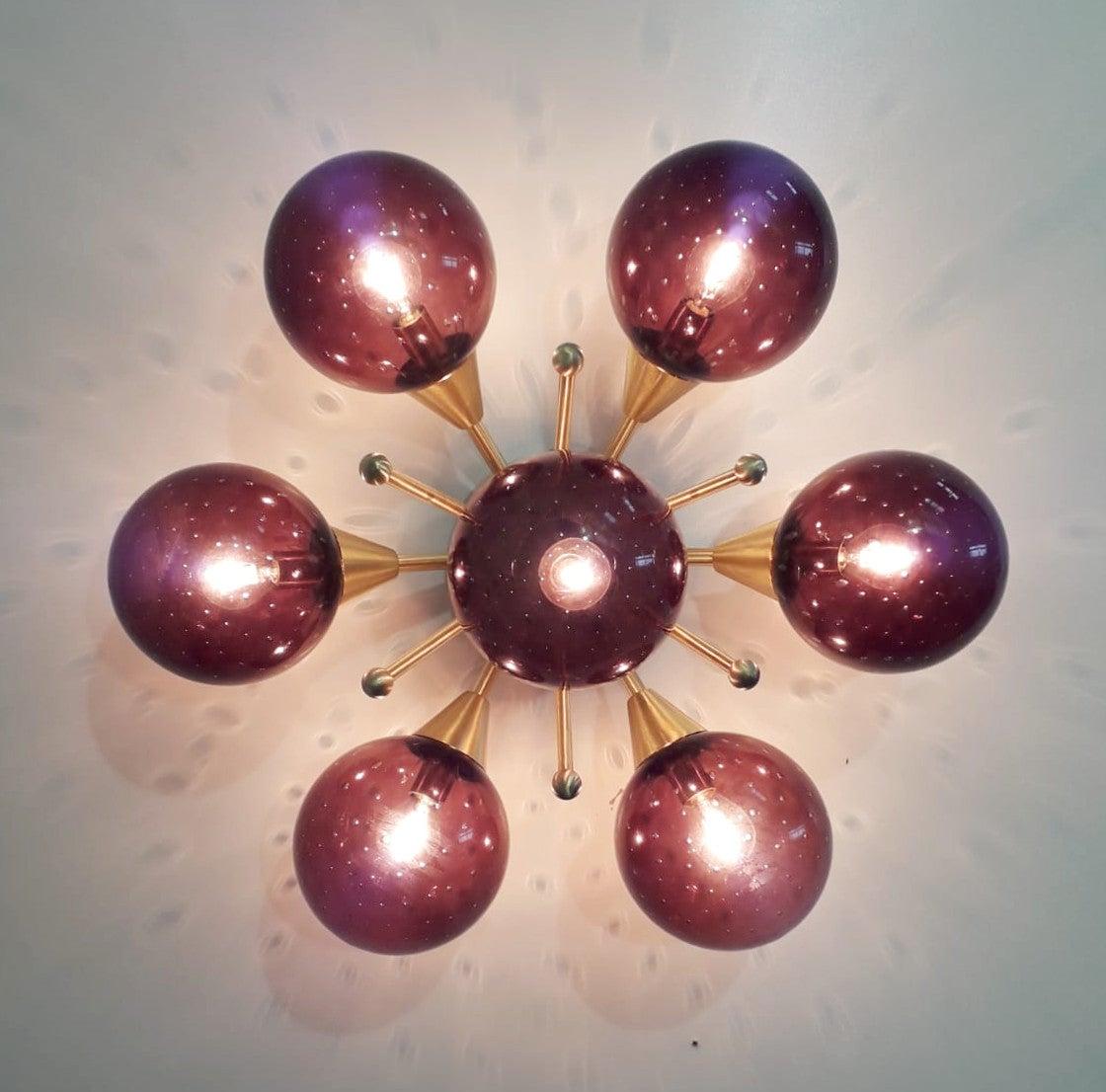 Italian flush mount with Murano glass globes mounted on solid brass frame 
Designed by Fabio Bergomi / Made in Italy 7 lights / E12 or E14 type / max 40W each 
Diameter: 24 inches / Height: 12 inches 
Order only / This item ships from Italy 
Order