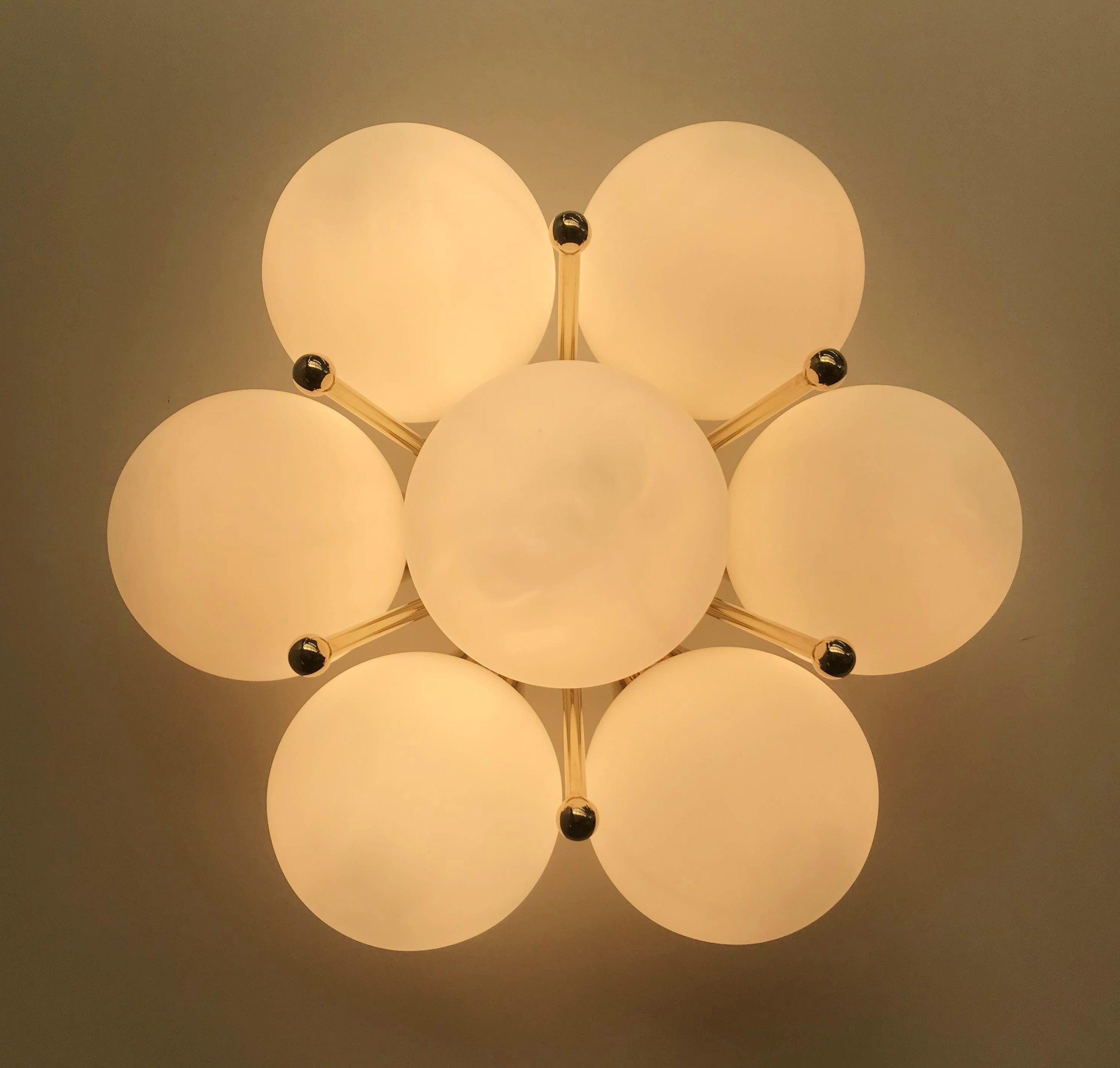 Italian flush mount with Murano glass globes mounted on solid brass frame
Designed by Fabio Bergomi / Made in Italy
7 lights / E12 or E14 type / max 40W each
Diameter: 22 inches / Height: 11 inches
Order only / This item ships from Italy
Order