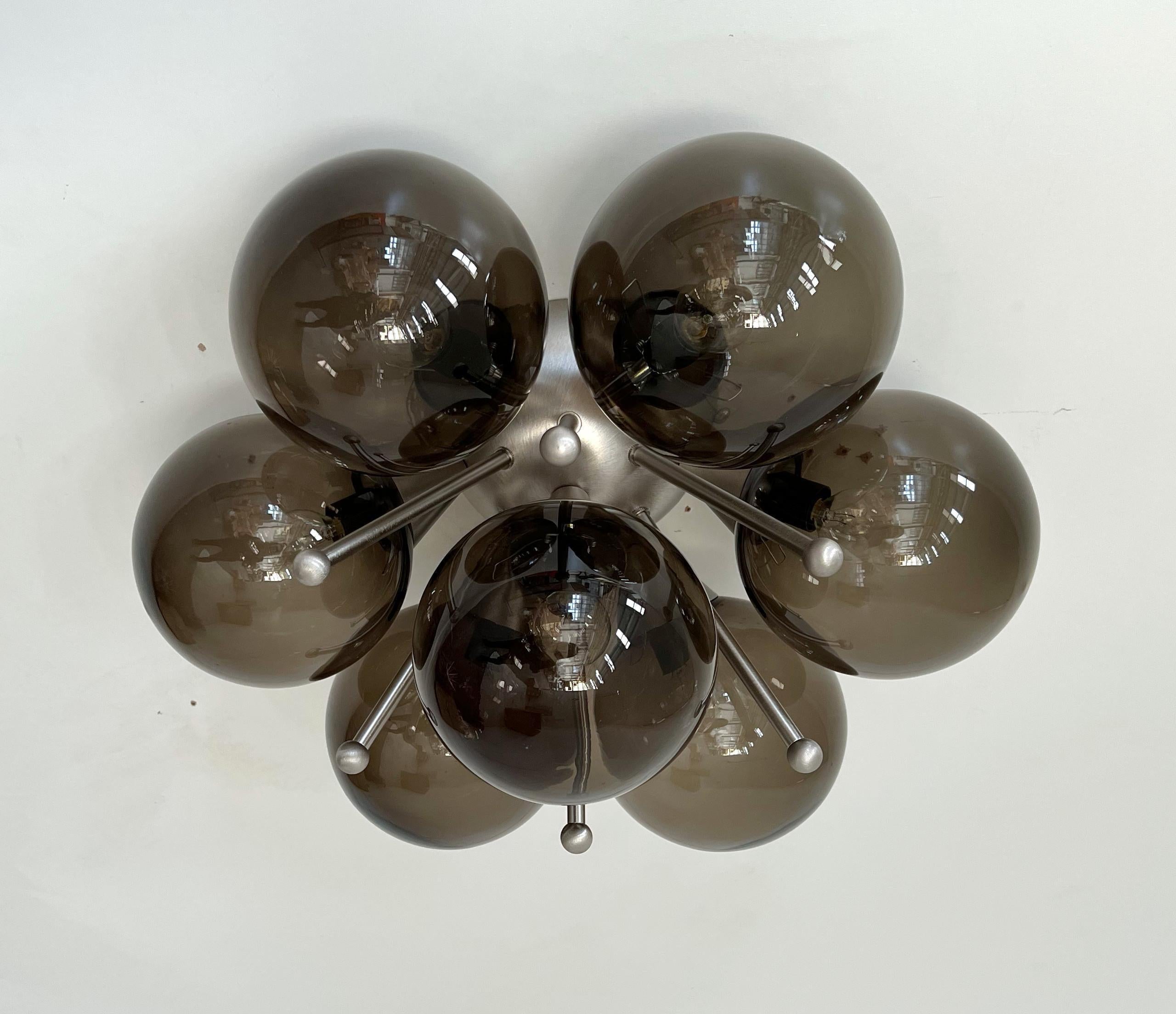 Italian flush mount with Murano glass globes mounted on solid brass frame
Designed by Fabio Bergomi / Made in Italy
7 lights / E12 or E14 type / max 40W each
Diameter: 22 inches / Height: 11 inches
Order only / This item ships from Italy
Order