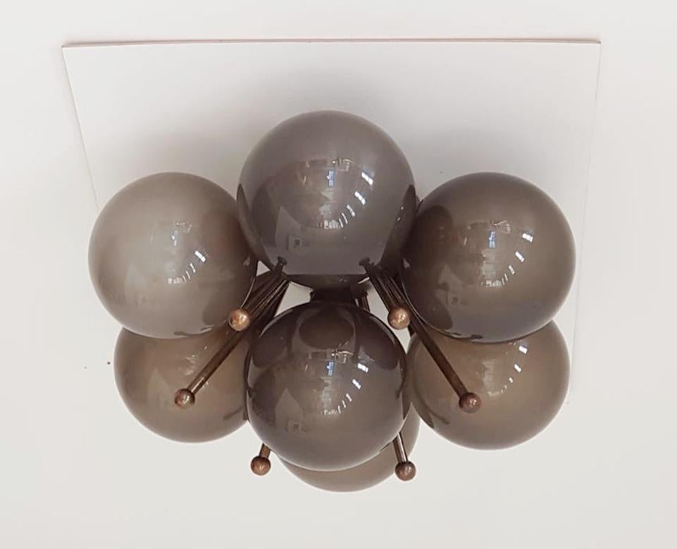 Italian flush mount with Murano glass globes mounted on solid brass frame
Designed by Fabio Bergomi / Made in Italy
7 lights / E12 or E14 type / max 40W each
Diameter: 22 inches / Height: 11 inches
Order only / This item ships from Italy
Order