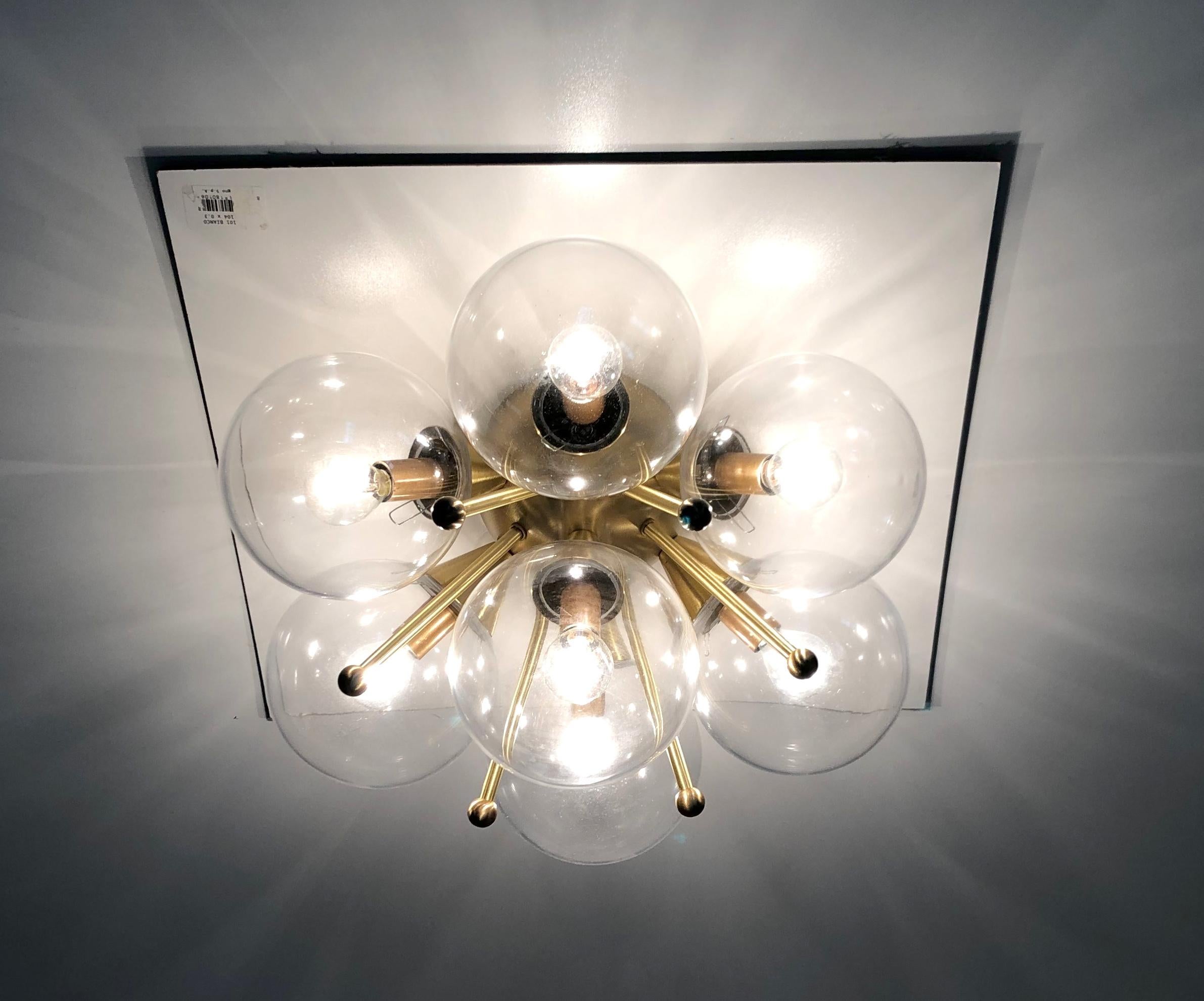 Italian flush mount with Murano glass globes mounted on solid brass frame 
Designed by Fabio Bergomi / Made in Italy 7 lights / E12 or E14 type / max 40W each 
Diameter: 22 inches / Height: 11 inches 
Order only / This item ships from Italy 
Order