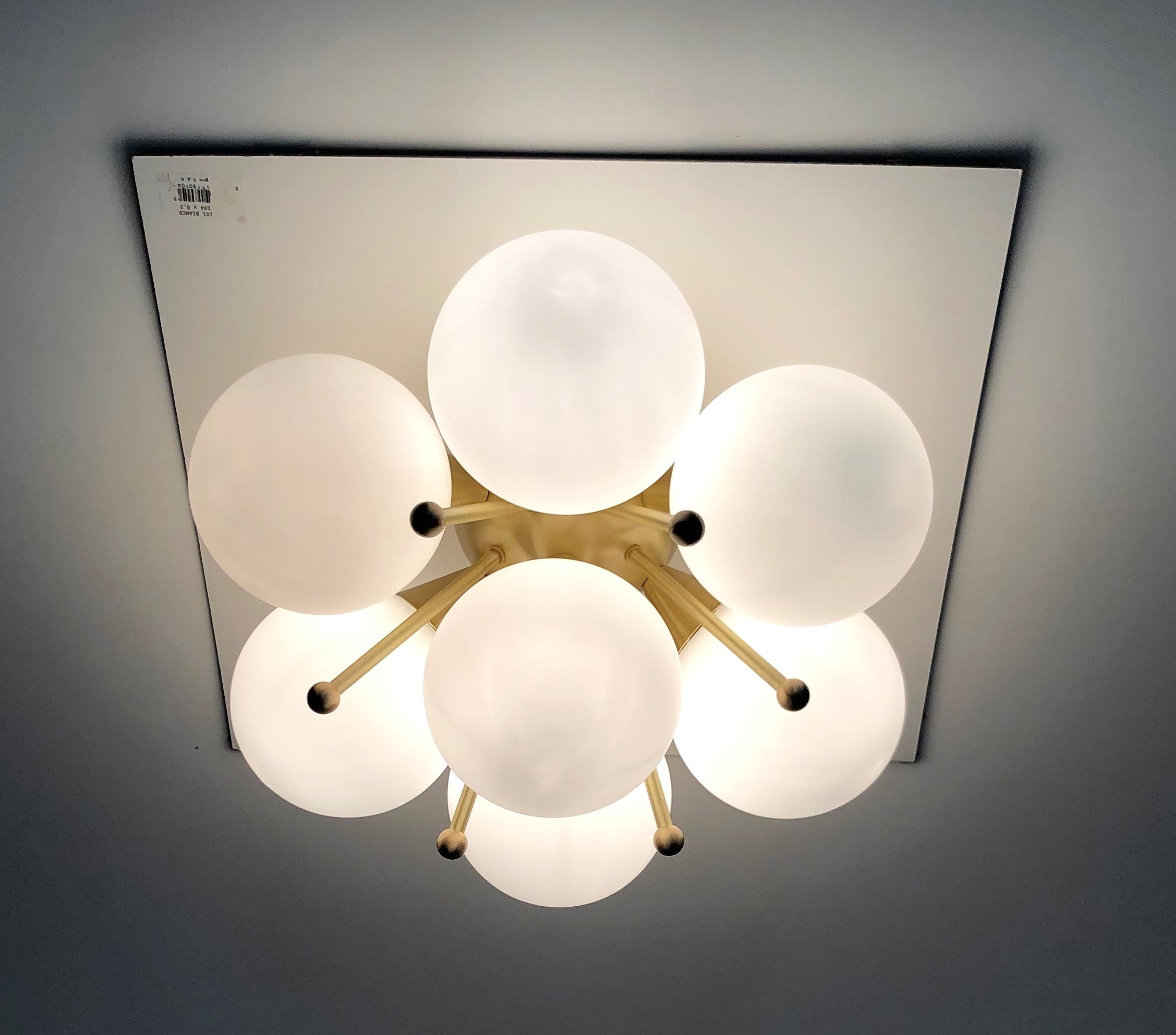 Italian flush mount with Murano glass globes mounted on solid brass frame 
Designed by Fabio Bergomi / Made in Italy 7 lights / E12 or E14 type / max 40W each 
Diameter: 22 inches / Height: 11 inches 
Order only / This item ships from Italy 
Order