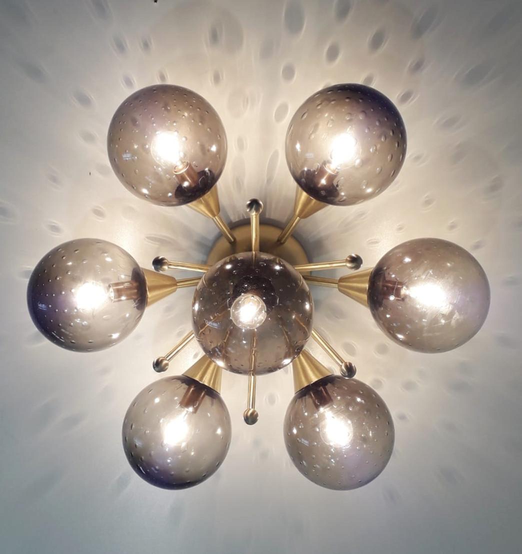 Italian flush mount with Murano glass globes mounted on solid brass frame
Designed by Fabio Bergomi / Made in Italy
7 lights / E12 or E14 type / max 40W each
Diameter: 24 inches / Height: 12 inches
Order only / This item ships from Italy
Order