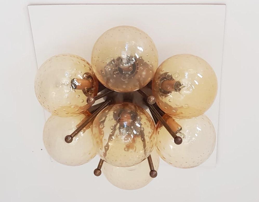 Italian flush mount with Murano glass globes mounted on solid brass frame
Designed by Fabio Bergomi / Made in Italy
7 lights / E12 or E14 type / max 40W each
Measures: Diameter: 22 inches / Height: 11 inches
Order only / This item ships from