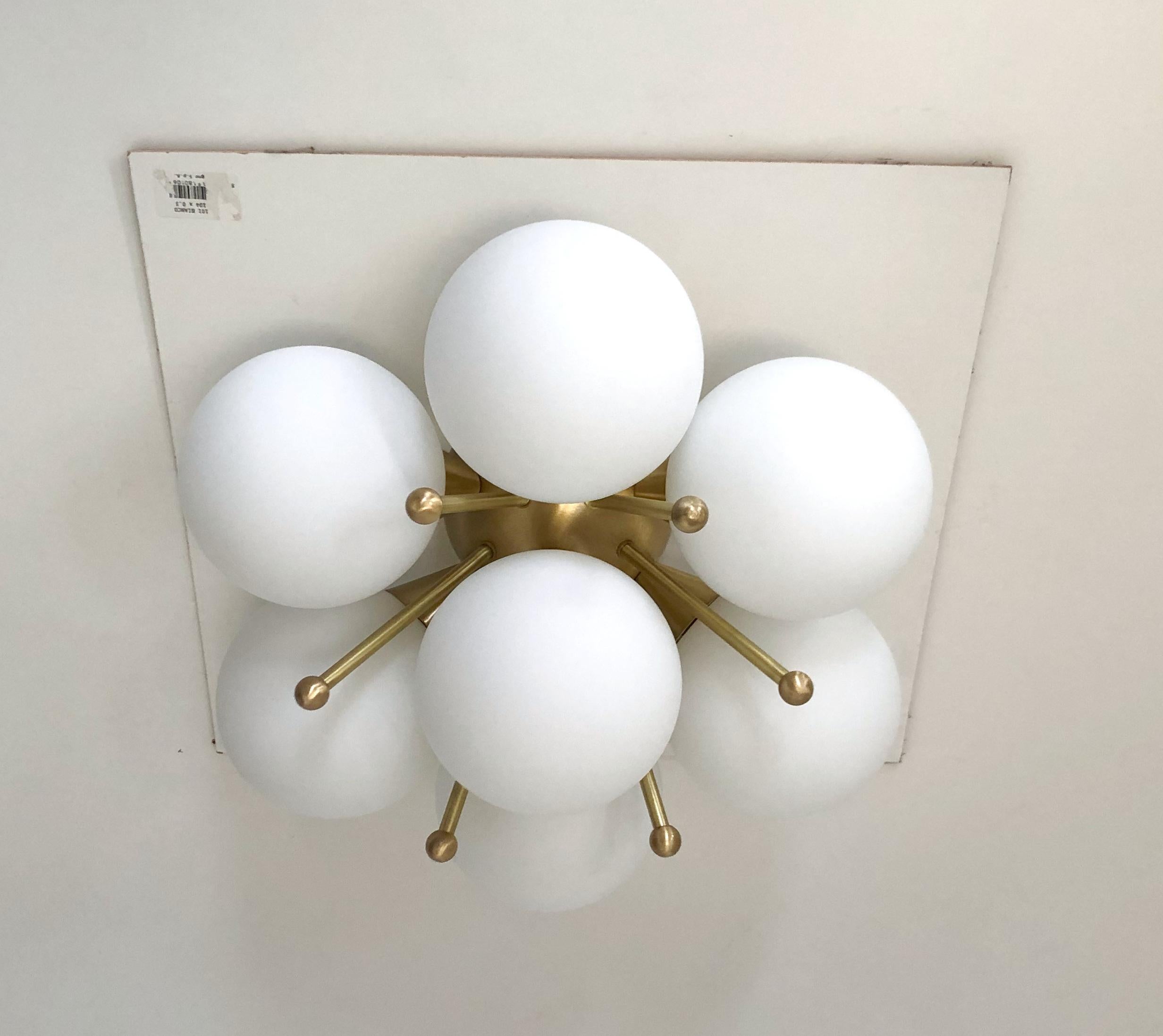 Italian flush mount with Murano glass globes mounted on solid brass frame
Designed by Fabio Bergomi / Made in Italy
7 lights / E12 or E14 type / max 40W each
Measures: diameter: 22 inches / height: 11 inches
Order only / This item ships from