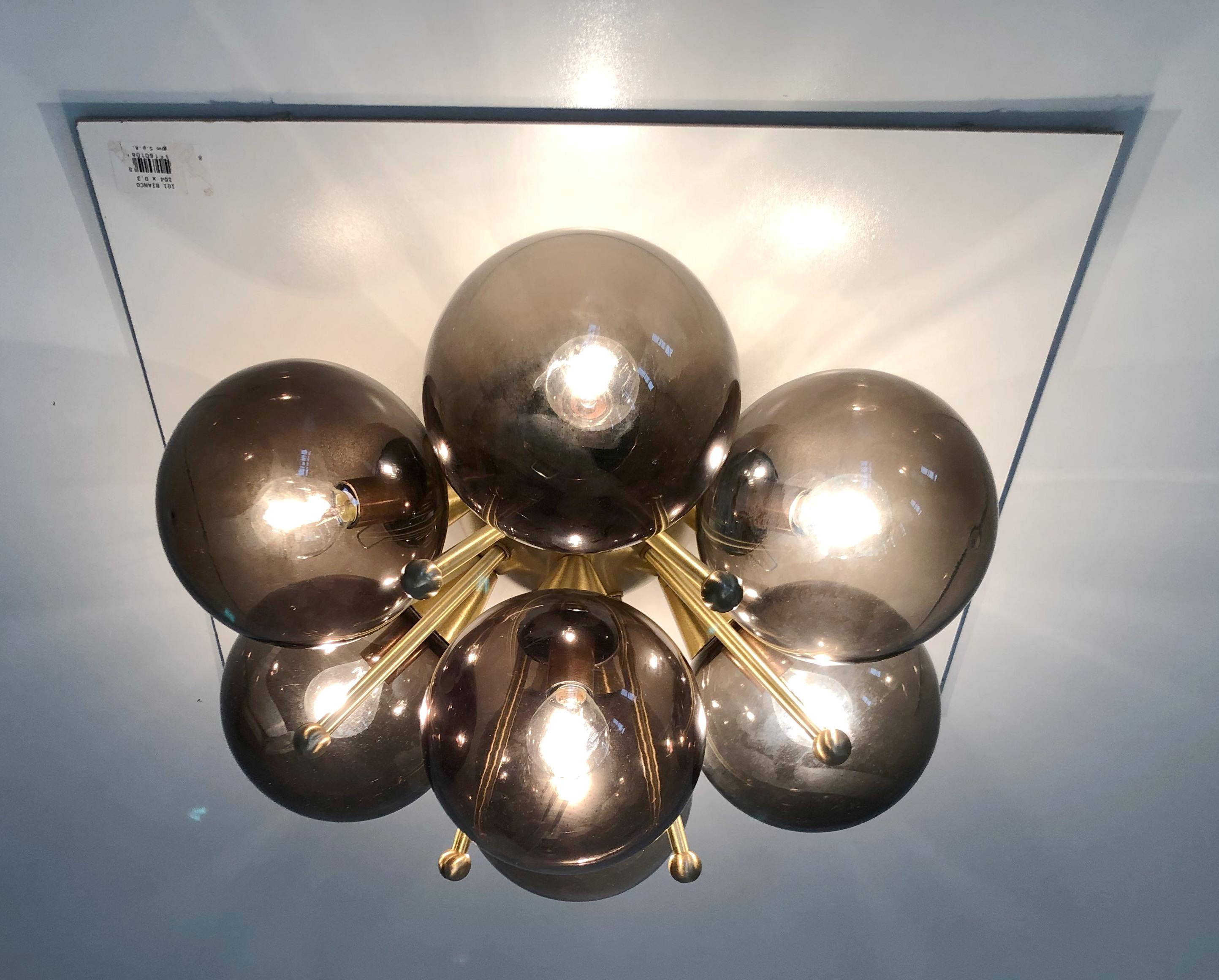 Italian flush mount with Murano glass globes mounted on solid brass frame 
Designed by Fabio Bergomi / Made in Italy 
7 lights / E12 or E14 type / max 40W each 
Diameter: 22 inches / Height: 11 inches 
Order only / This item ships from Italy 
Order
