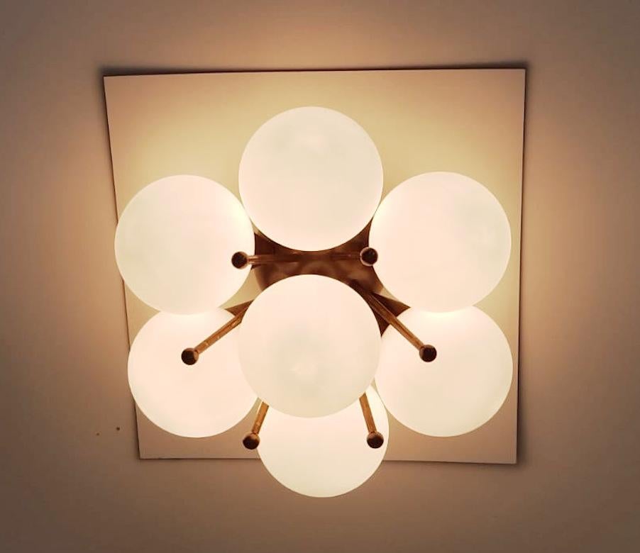 Italian flush mount with Murano glass globes mounted on solid brass frame
Designed by Fabio Bergomi / Made in Italy
7 lights / E12 or E14 type / max 40W each
Diameter: 22 inches / Height: 11 inches
Order only / This item ships from Italy
Order