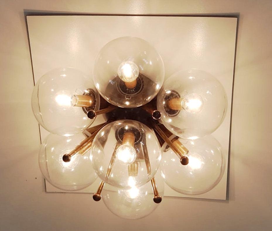 Italian flush mount with Murano glass globes mounted on solid brass frame
Designed by Fabio Bergomi / Made in Italy
7 lights / E12 or E14 type / max 40W each
Diameter: 22 inches / Height: 11 inches
Order only / This item ships from Italy
Order