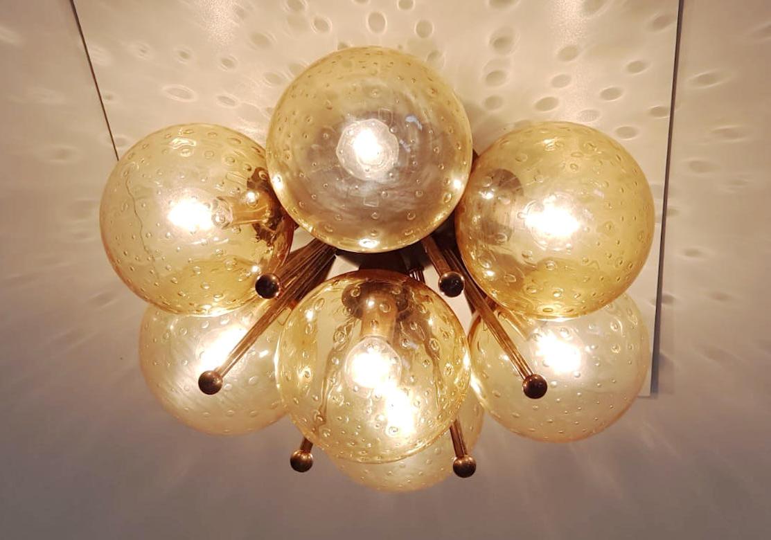 Italian flush mount with Murano glass globes mounted on solid brass frame
Designed by Fabio Bergomi / Made in Italy
7 lights / E12 or E14 type / max 40W each
Diameter: 22 inches / Height: 11 inches
Order only / This item ships from Italy
Order