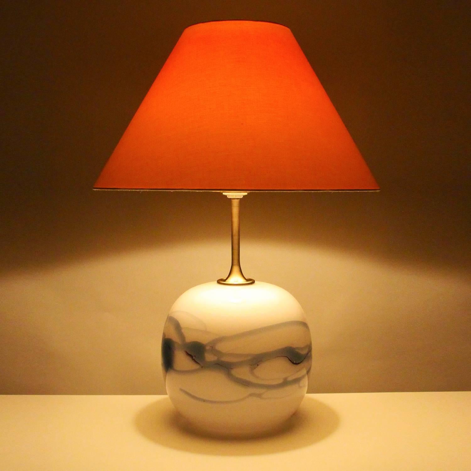 Sakura, large blown glass table lamp by Michael Bang in 1980 for Holmegaard glassworks - beautiful milky white and blue lamp stand with large colorful shade included, in excellent vintage condition.

This large round lamp stand is made up of milky