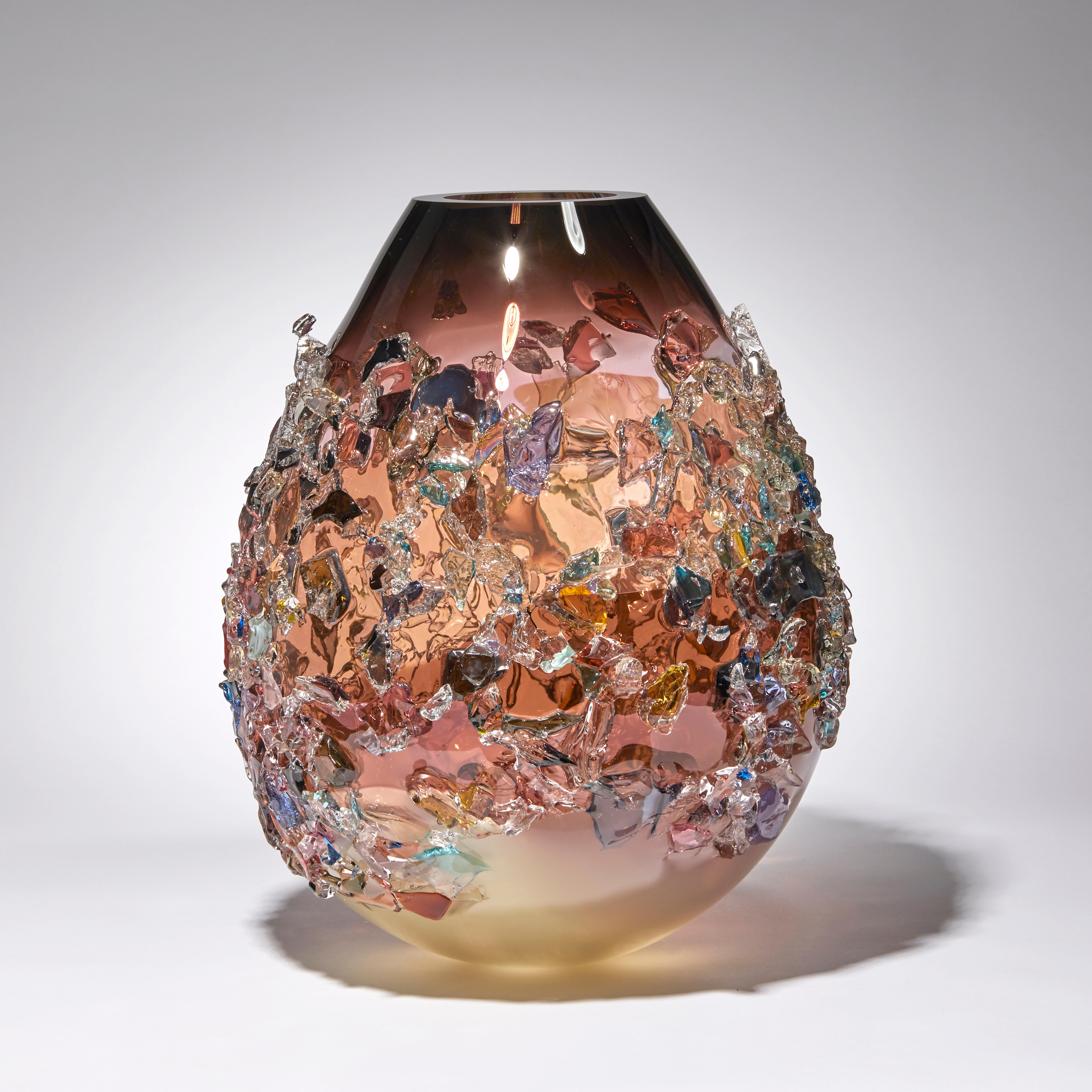 Sakura TRP20017 is a unique dark pink, ivory / alabaster and multicolored hand blown art glass sculptural vase, covered in an organic glass shard adornment by the Dutch artist Maarten Vorlijk. The piece is flame polished to soften the edges of all