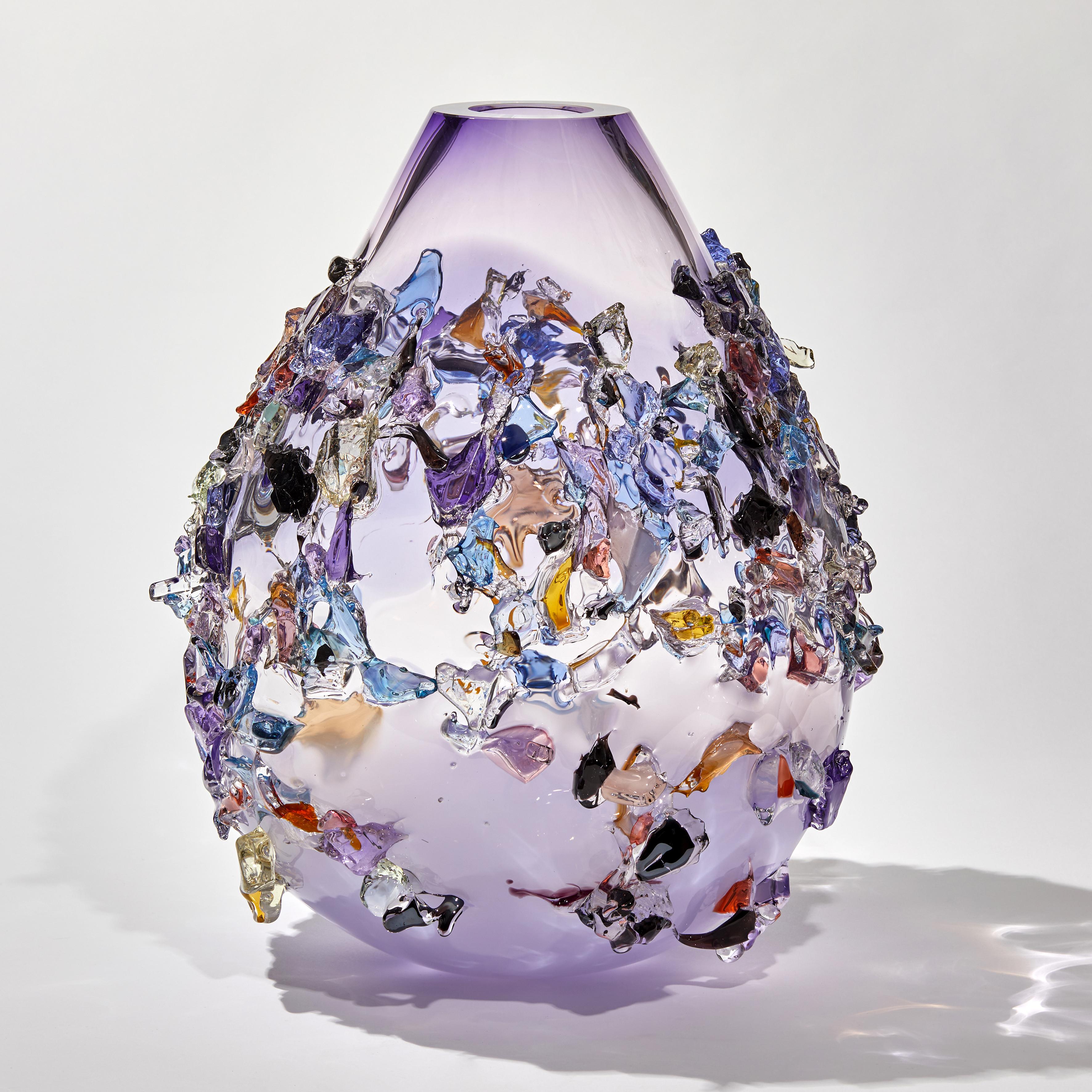 Sakura TRP21001 is a unique soft purple, lilac and multicolored hand-blown art glass sculptural vase, covered in an organic glass shard adornment by the Dutch artist Maarten Vorlijk. The piece is flame polished to soften the edges of all the