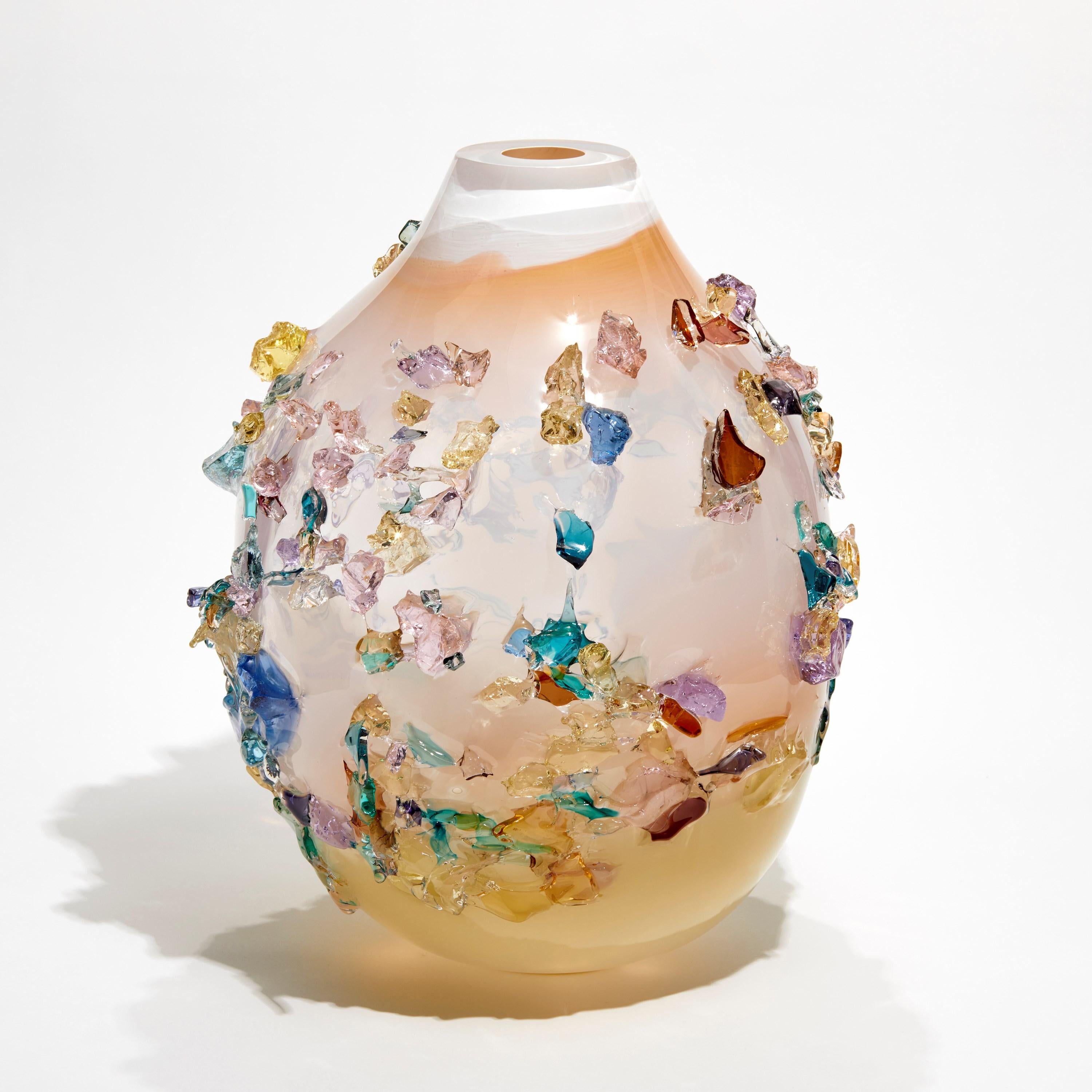 Sakura TRP21015 is a unique soft coral, dusky pink, white and multicolored hand-blown art glass sculptural vase, covered in an organic glass shard adornment by the Dutch artist Maarten Vorlijk. The piece is flame polished to soften the edges of all
