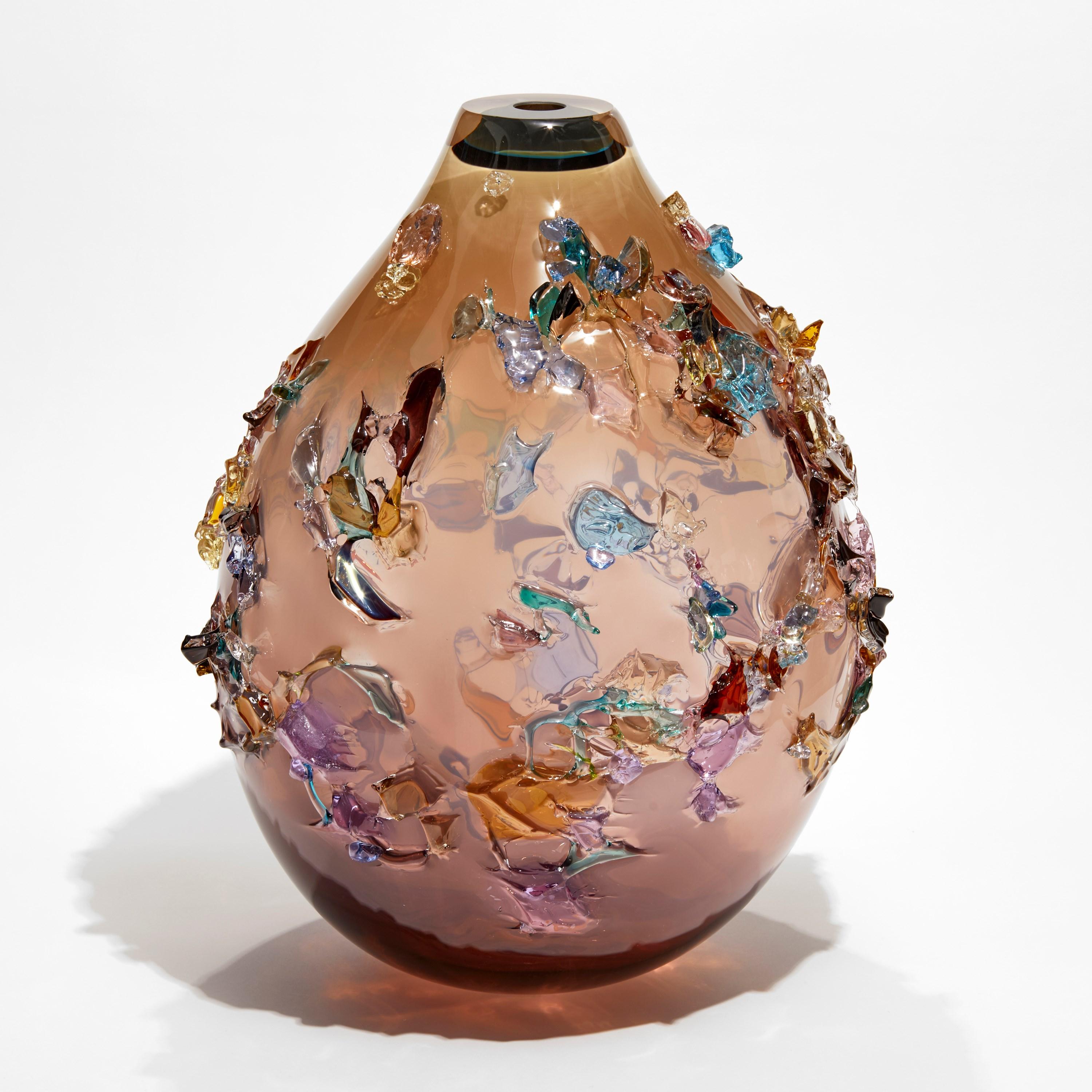  Sakura TRP22003 is a unique softy pink/aubergine and multicolored hand-blown art glass sculptural vase, covered in an organic glass shard adornment by the Dutch artist Maarten Vorlijk. The piece is flame polished to soften the edges of all the