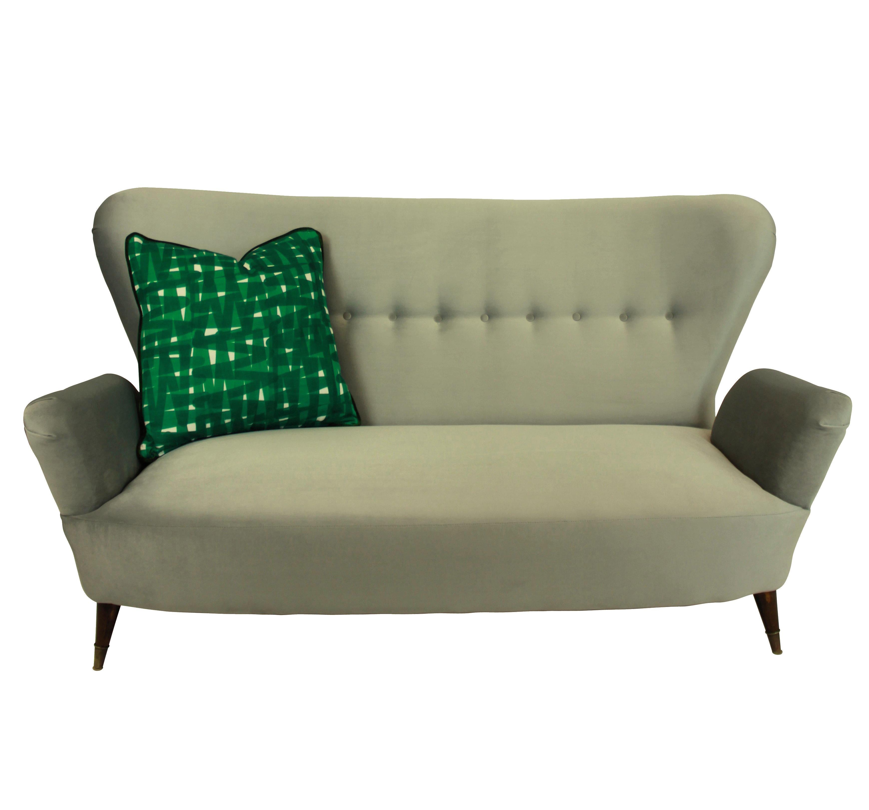 A stylish Italian sofa of good shape with tapering legs and brass sabot by Emilia Sala and Giorgio Madini (designer), Fratelli Galimberti Cantù (manufacturer). Newly upholstered in silver grey velvet, with seat cushions removed for better