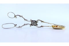 Salad, bread or sauce tongs in scalloped silver