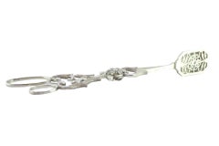 Salad, bread or sauce tongs in scalloped silver