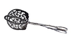 Salad or bread tongs in cut-out silver with raised handles