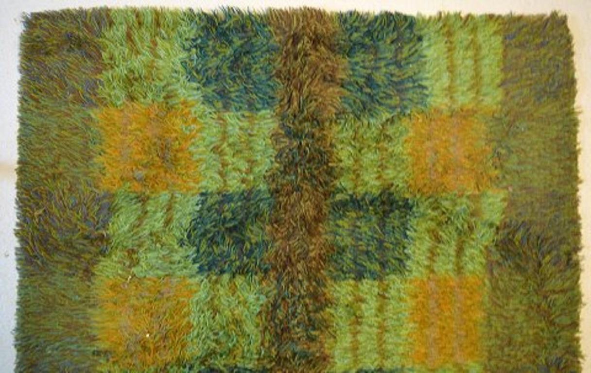 Salanders, Sweden. Rya rug in pure wool. Geometric fields in shades of green, yellow and blue, 1960s-1970s.
Measures: 185 x 130 cm.
In excellent condition.
Sticker.