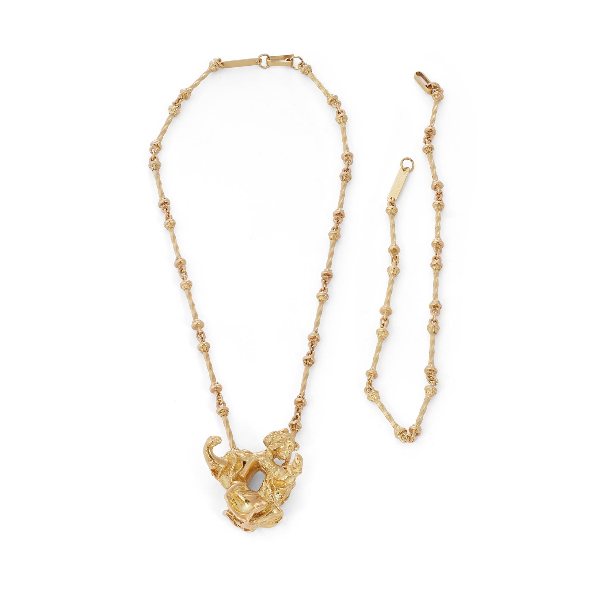 Authentic limited edition Salvador Dalí Madonna de Port Lligat necklace crafted in 18 karat textured yellow gold.  The artist's depiction of the Madonna is represented here in a solid gold pendant measuring approximately 1.67 inches long and 1.34