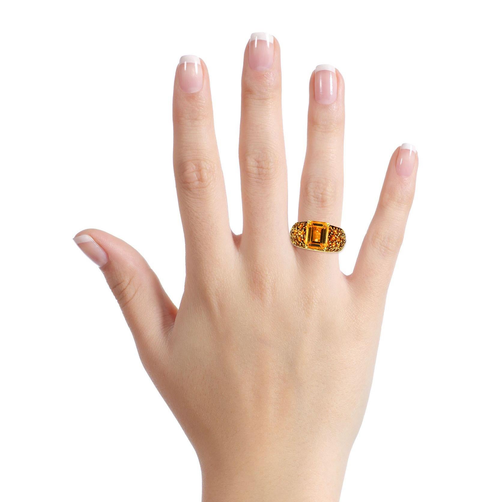 Salavetti cocktail ring in 18-karat yellow gold with Imperial Citrine. Polished metal setting with an emerald-cut natural citrine center that weighs about 2.90 carats, surrounded by pave set round-cut Citrines. Made in Italy. Retail $4,800. 

Size,