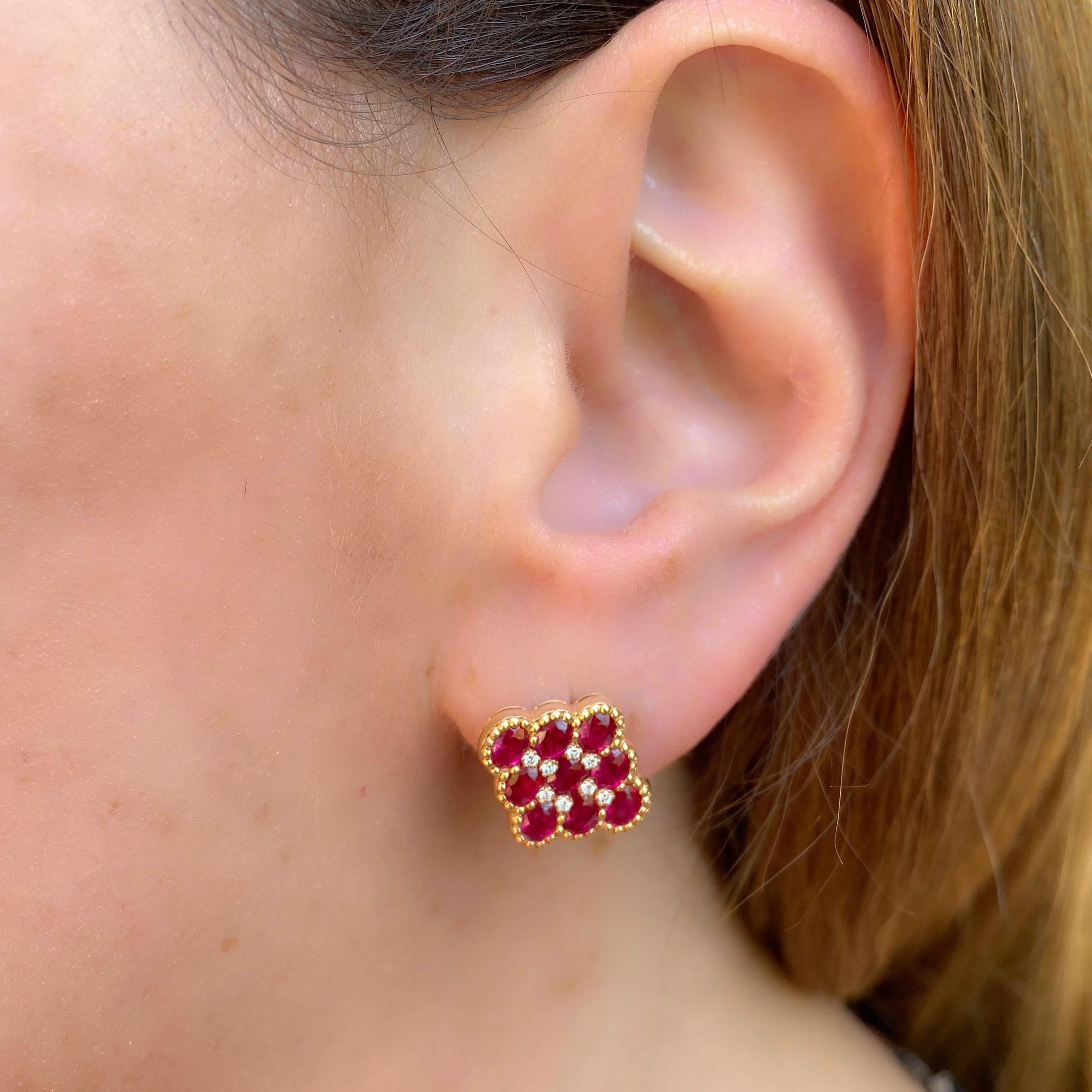 Vibrantly red, these 18k rose gold stud earrings are a unique find! The kite shaped posts are set with 18 oval-shaped rubies, deep red and well saturated, weighing in total 3.70 carats, and accented with 16 round brilliant-cut diamonds weighing