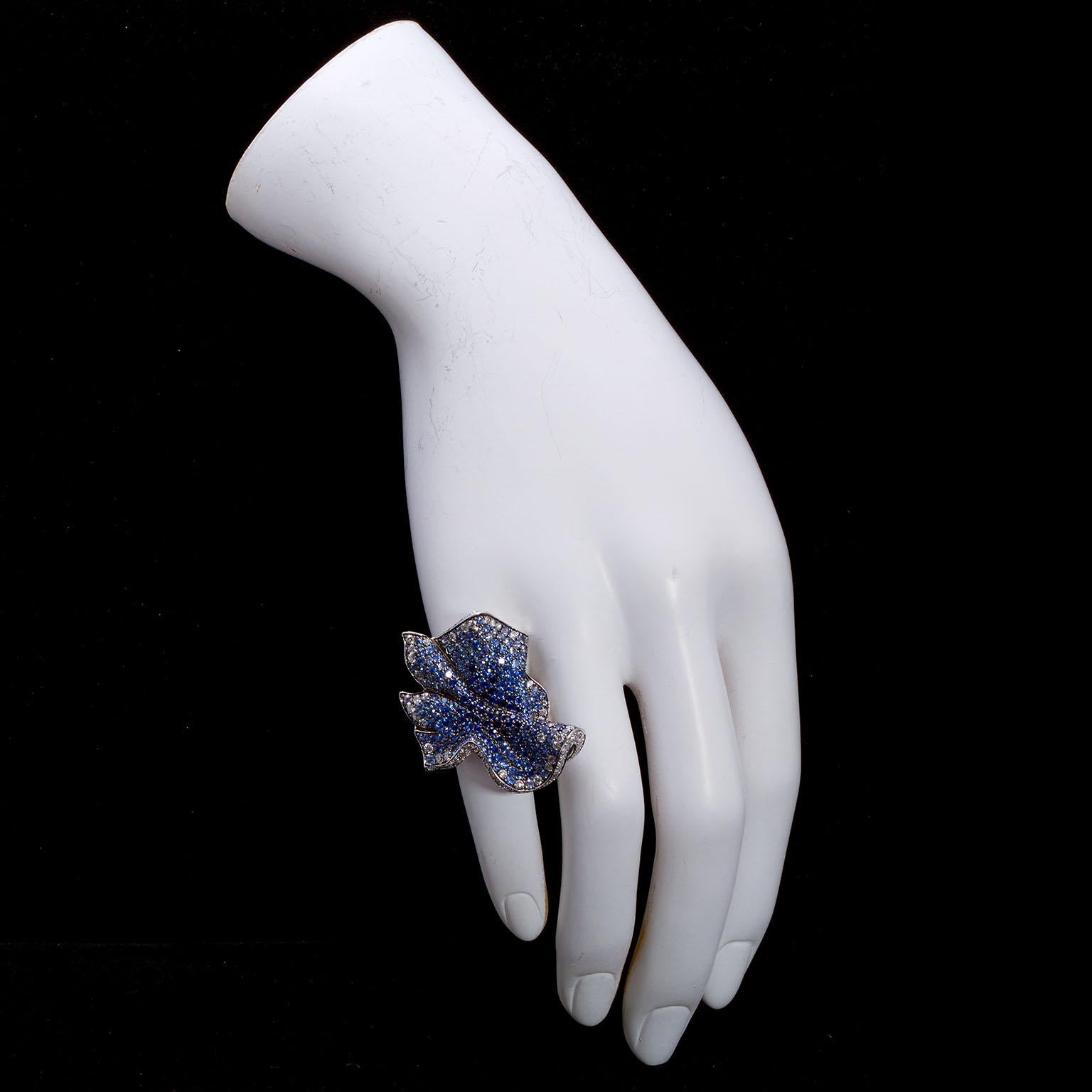 An 18k white gold ring by Italian designer Salavetti, set with 5.03 ctw of round cut sapphires and 2.18 ctw of round diamonds, ring weight 16.30 dwt.
Ring size: 7 US

No. TMWJ-8820