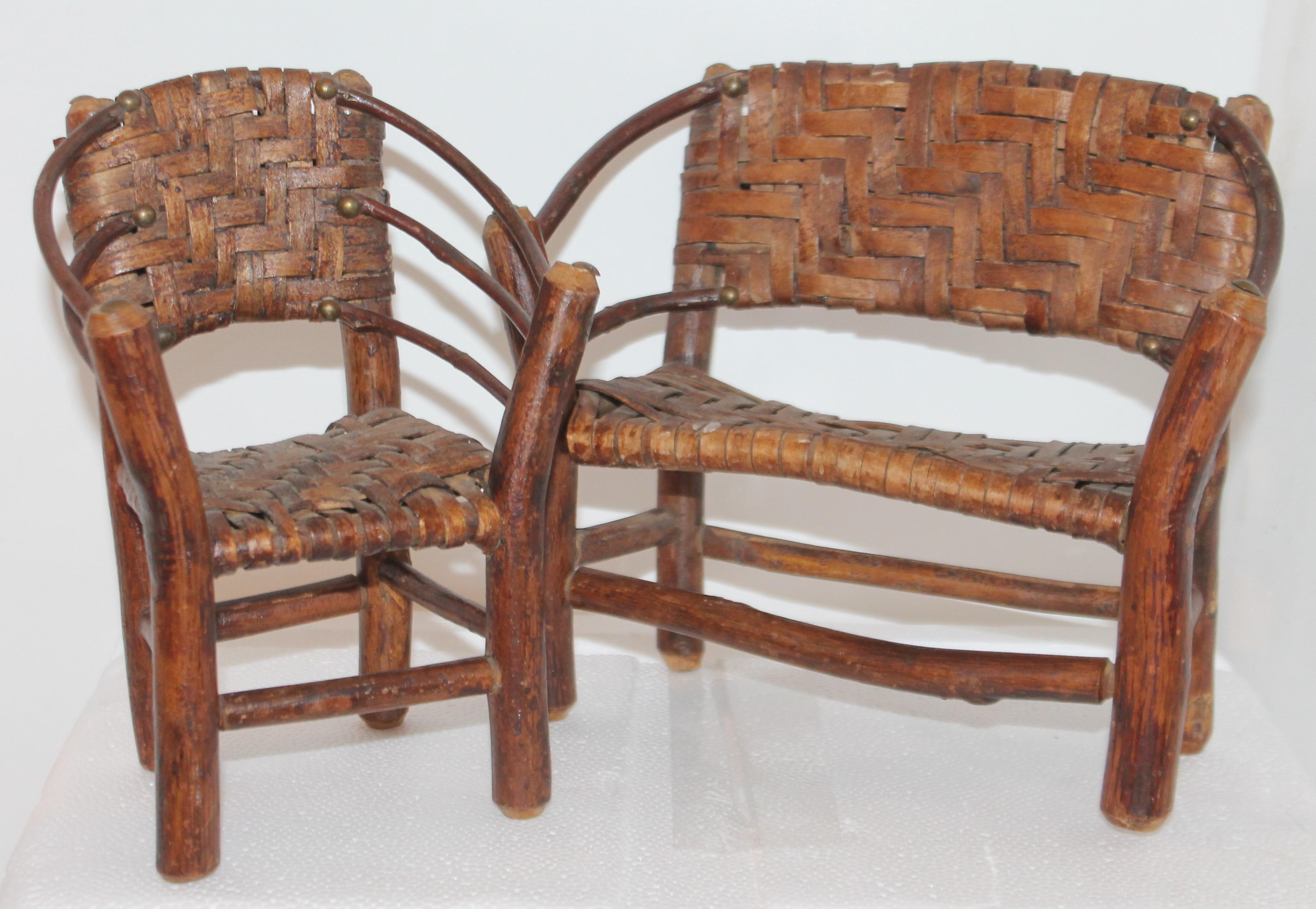 This fun little shelf height hickory settee and side chair are in Fine condition and retain a fantastic old surface. Sold as a two-piece set.
 Great for a doll or teddy bear collector.