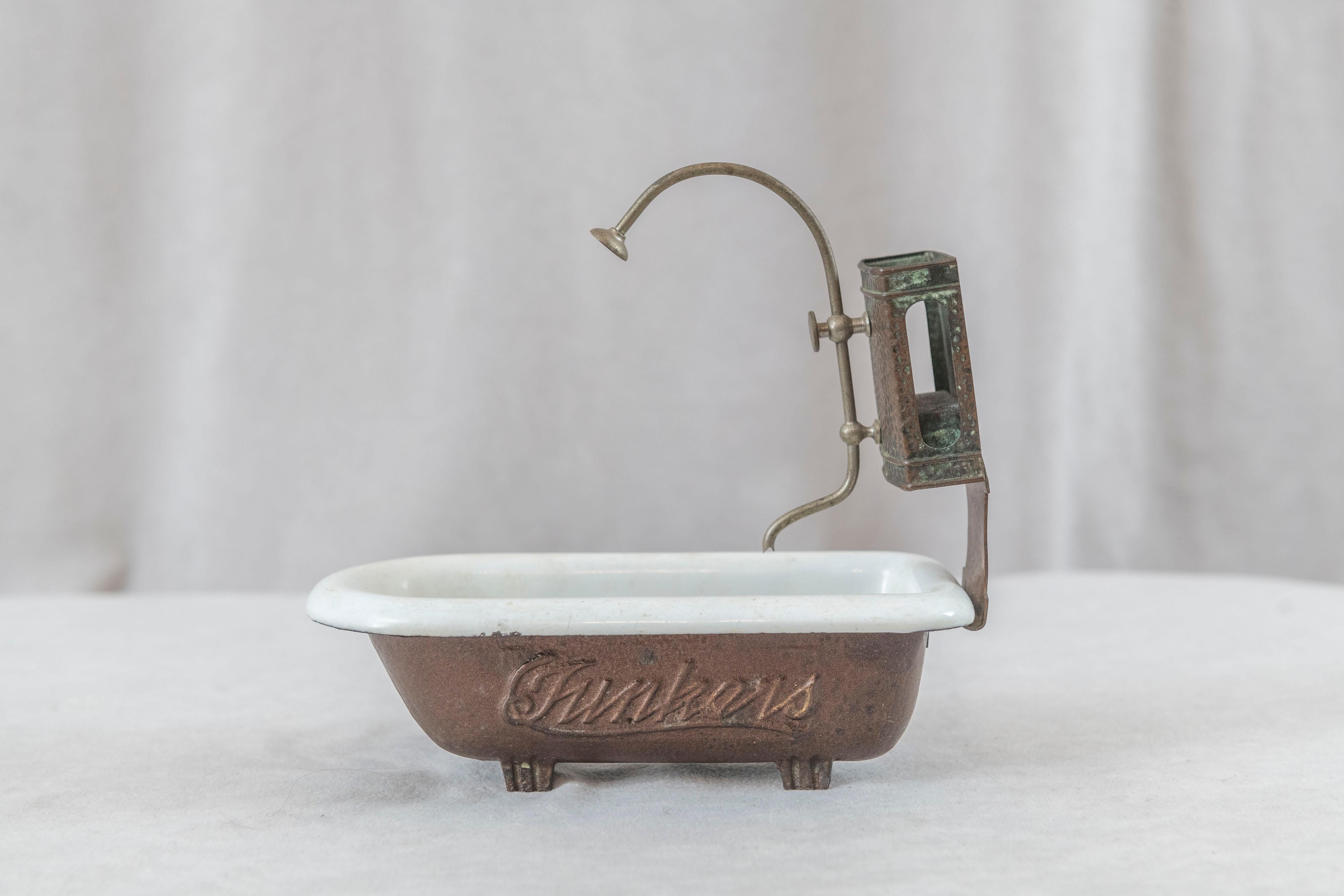 This wonderful Salesman's sample of a bathtub looks exactly like it should, has all the bells and whistles the original had. It was an example of the Hunker's Co. which is plainly written in 2 places. The body was made by Cimbria for Hunkers and is