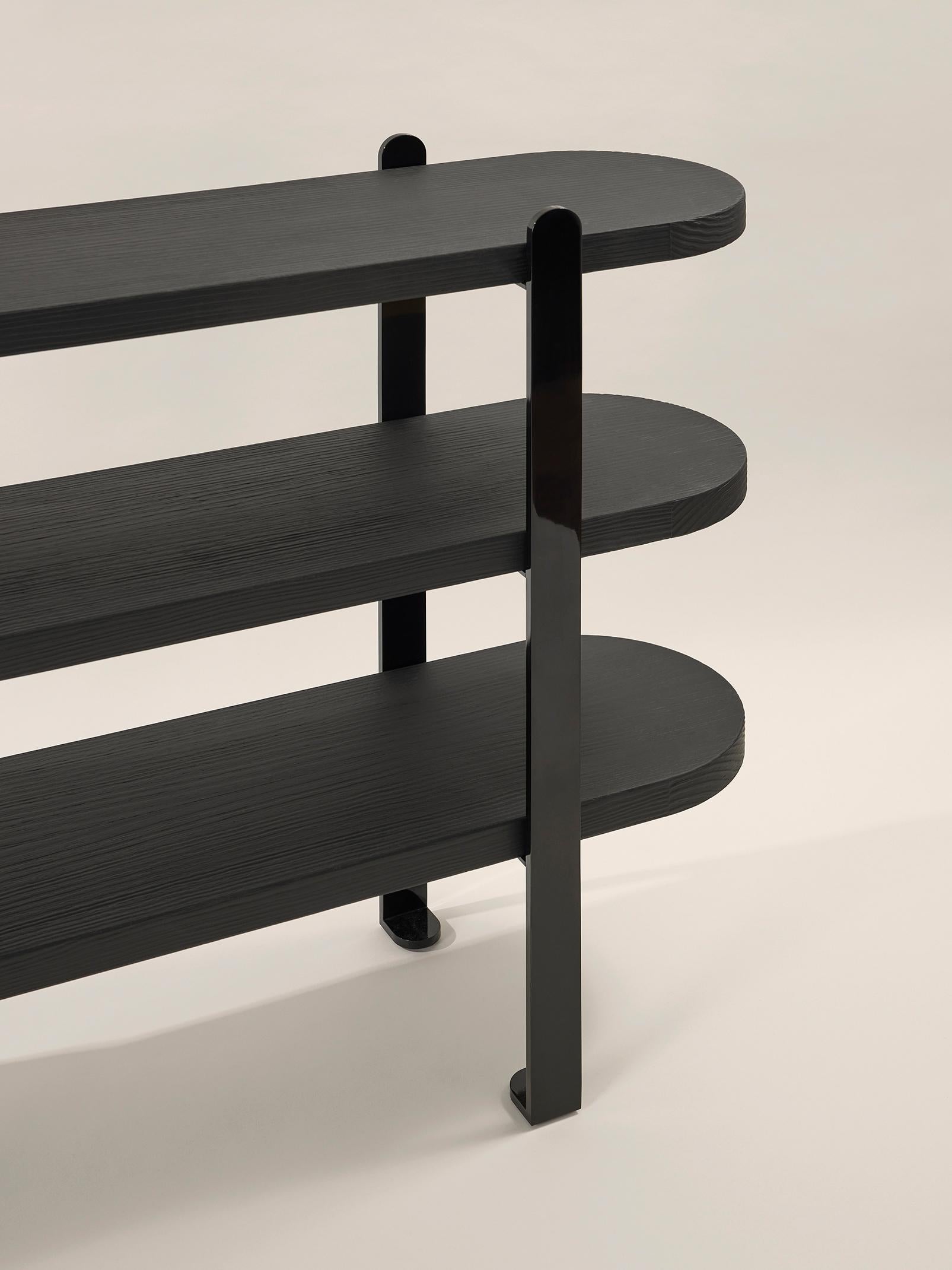 Console Salima
Trays in brushed pine tainted in black
Structure in shiny black metal (RAL 9005)
L 160 x P 33 x H 95 cm

Evoking both nothingness and infinity in the collective unconscious, the color black is laden with mystery and a natural power