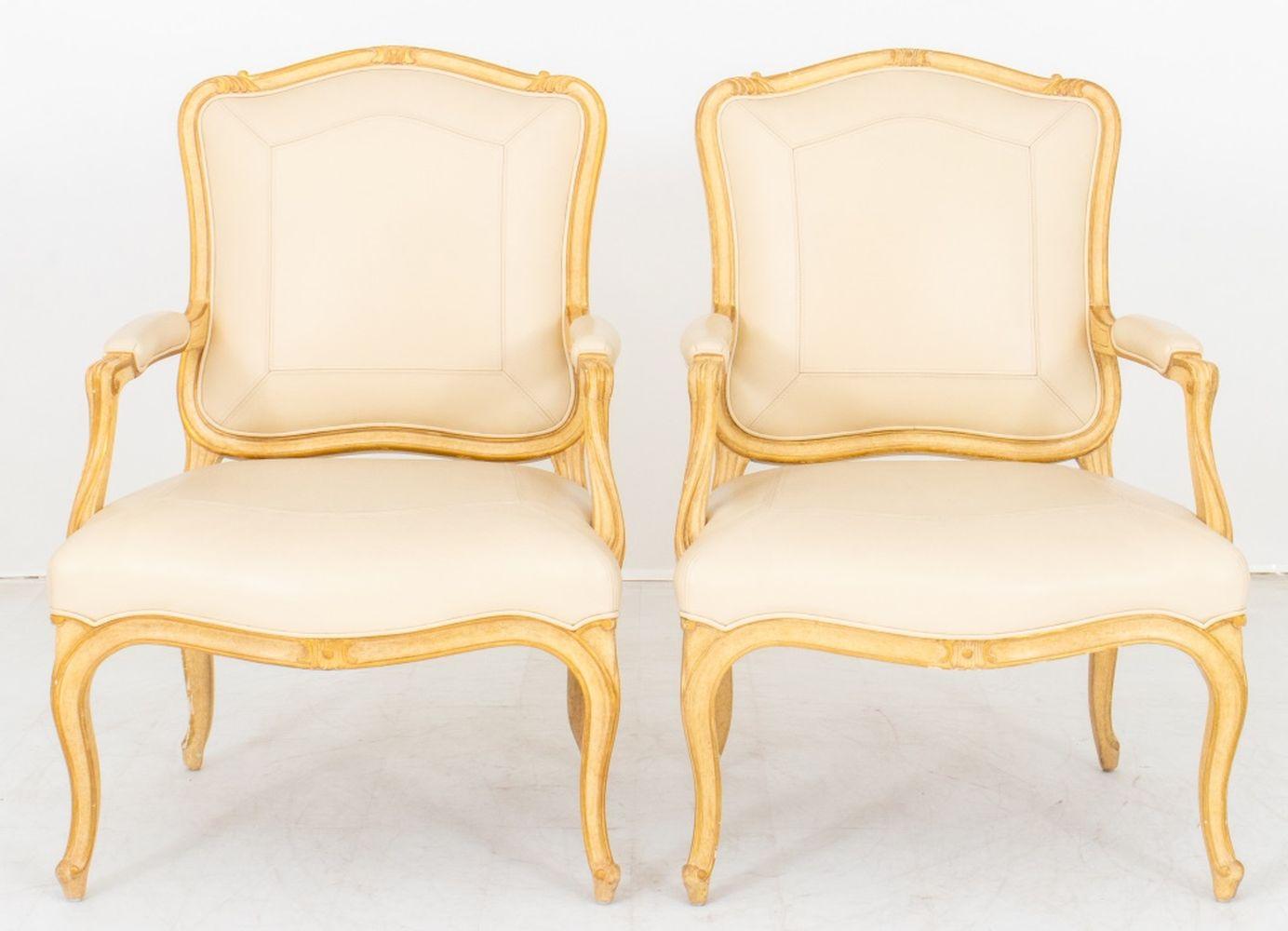 Pair of Sally Sirkin Lewis for John Robert Scott Louis XV Style Fauteuils, with giltwood frame and cream colored leather upholstery, labeled 