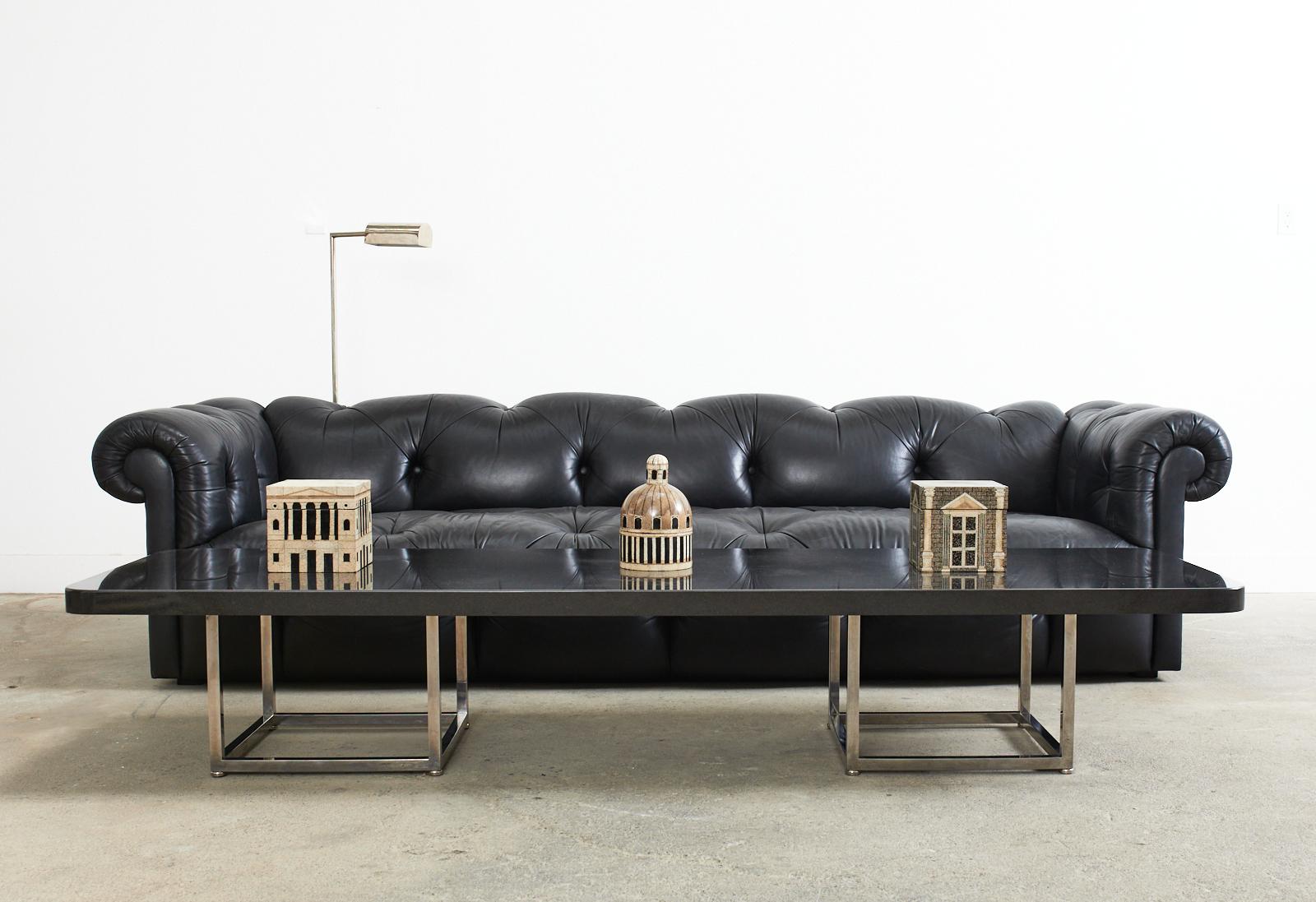 Grand bespoke black leather English chesterfield style tufted leather sofa designed by Sally Sirkin Lewis for J. Robert Scott & Assoc. Sirkin's modern redux of a classic English sofa features a hardwood frame with large English rolled arms