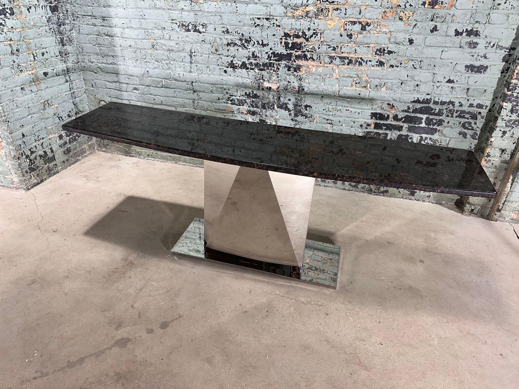 Style of Sally Sirkin Lewis Multi Faceted Stainless Steel and Granite Console, 1970.
Measures 82
