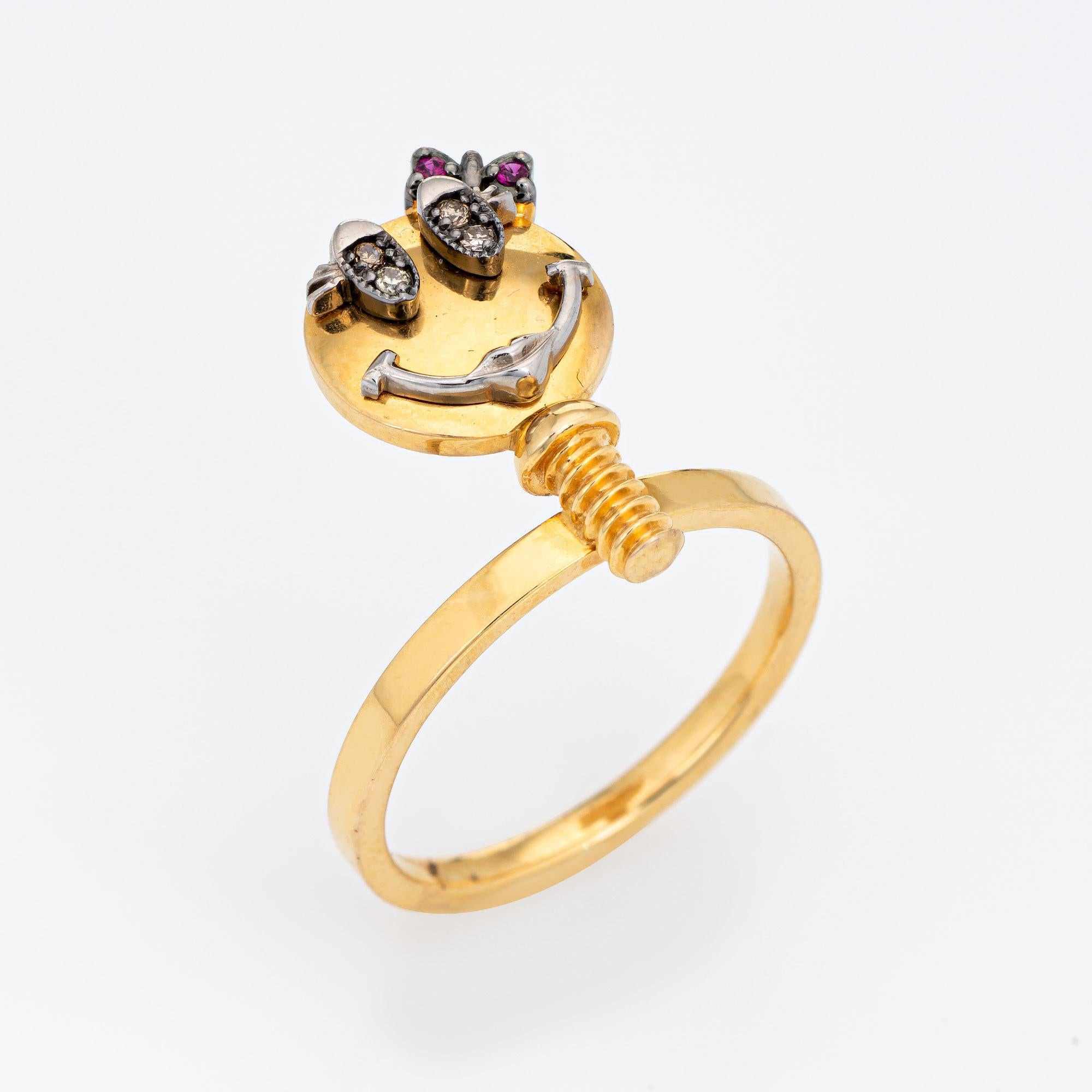 Stylish Sally Sohn happy face ring crafted in 18 karat yellow gold. 

Diamonds total an estimated 0.02 carats and rubies total an estimated 0.01 carats.  

Sally Sohn is a South Korean jewelry designer known for one-of-a-kind wearable works of art.