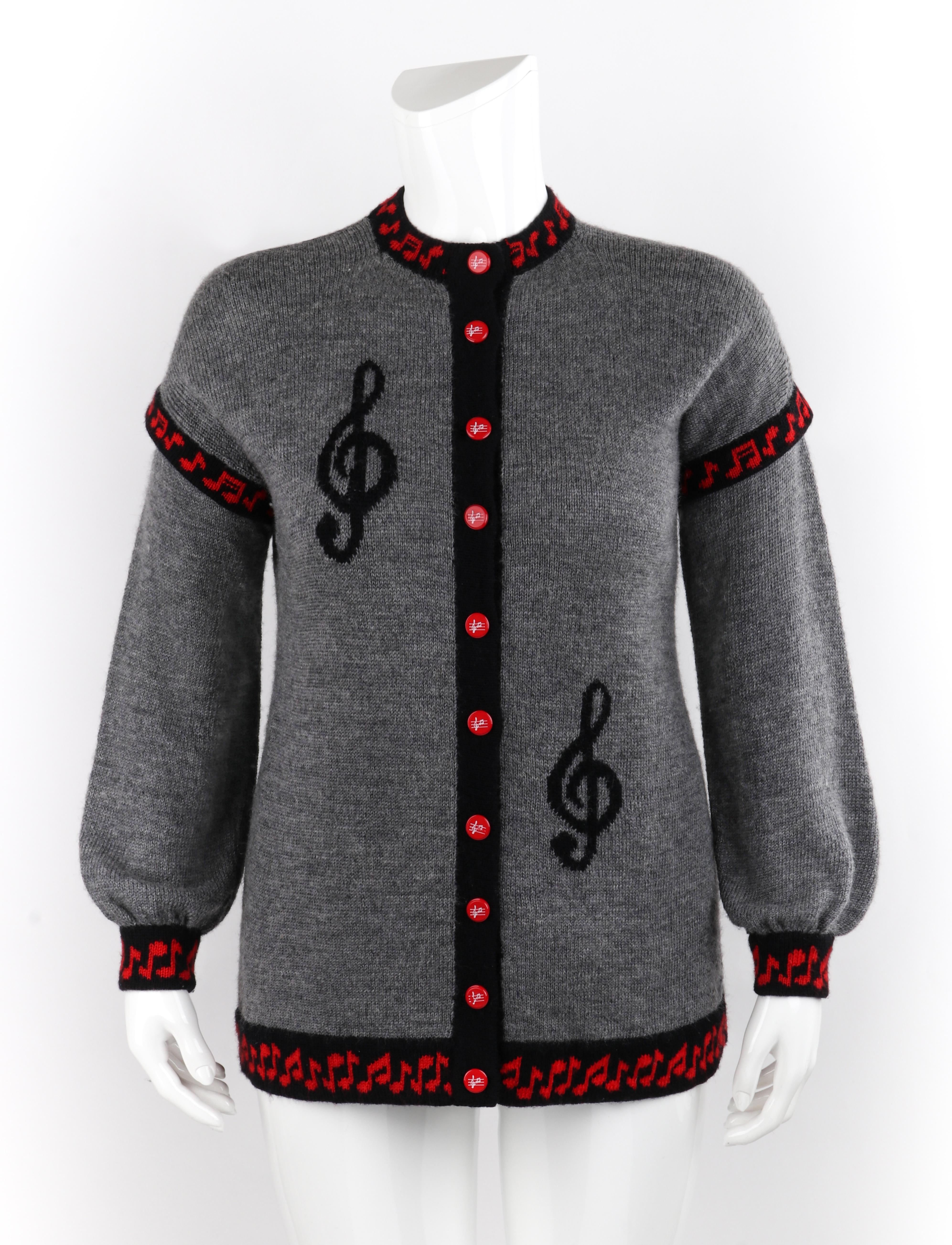 SALLY’S OWN c.1980’s Gray Red Black Music Note Knit Button Up Cardigan Sweater

Circa: 1980’s
Label(s): Sally’s Own; Woolmark tag
Style: Cardigan sweater
Color(s): Shades of red, gray, and black
Lined: No
Marked Fabric Content: “Pure New Wool”