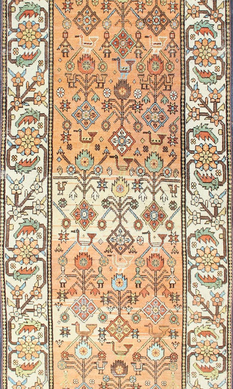 Tribal Salmon Background and Earth Tone Antique Bakitari Rug with All-Over Patten For Sale