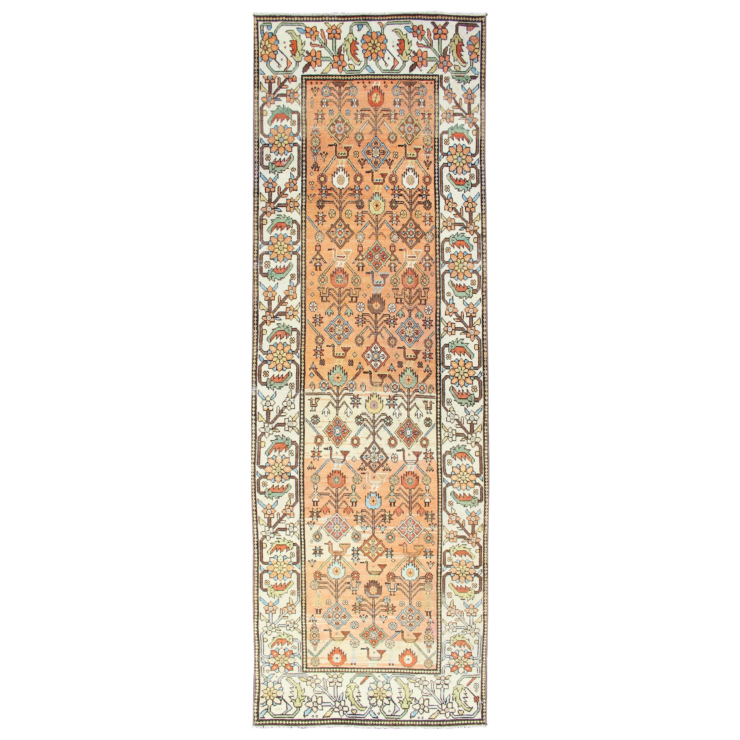 Salmon Background and Earth Tone Antique Bakitari Rug with All-Over Patten For Sale