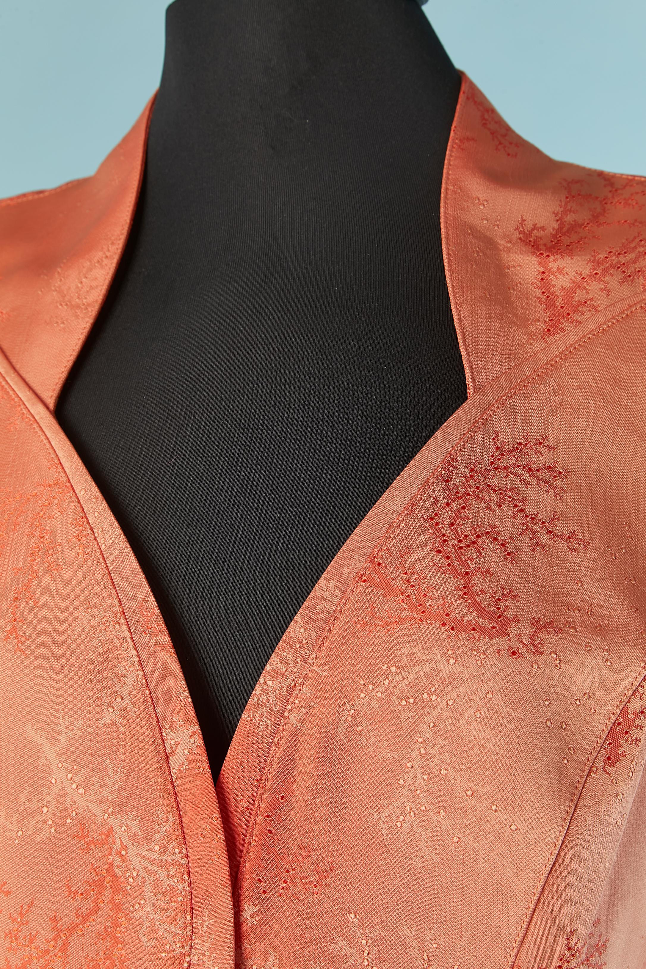 Salmon jacquard acetate ( 64%) and silk (36%) single-breasted jacket. 
Lining probably acetate or rayon ( no composition tag regarding the lining) 
Cut-work. Pockets on both side. Shoulder-pads. 
SIZE 44 (Fr) L 