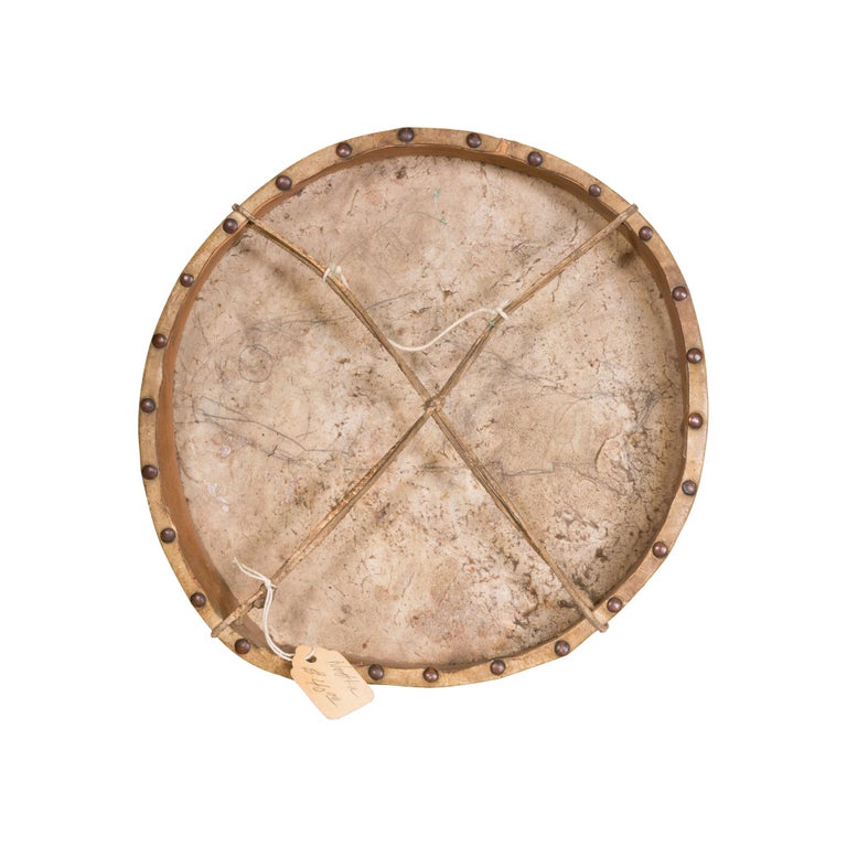 Nootka hand drum with polychrome salmon, brass tacks, brain tanned handhold, original sale tag of $40.

Period: First quarter of the 20th century
Origin: Nootka, Northwest
Size: 8
