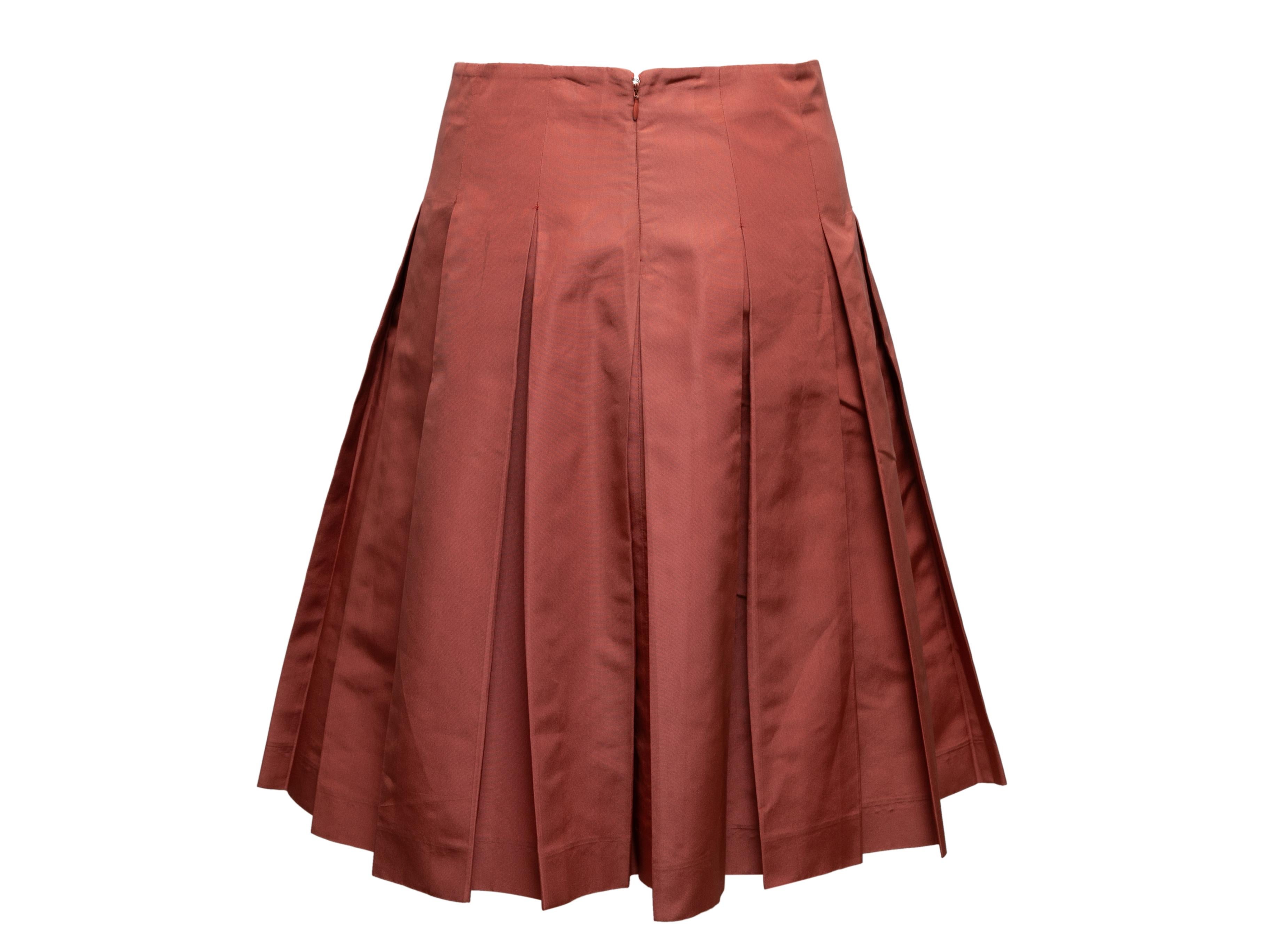 Salmon silk pleated skirt by Prada. Zip closure at center back. 28.5