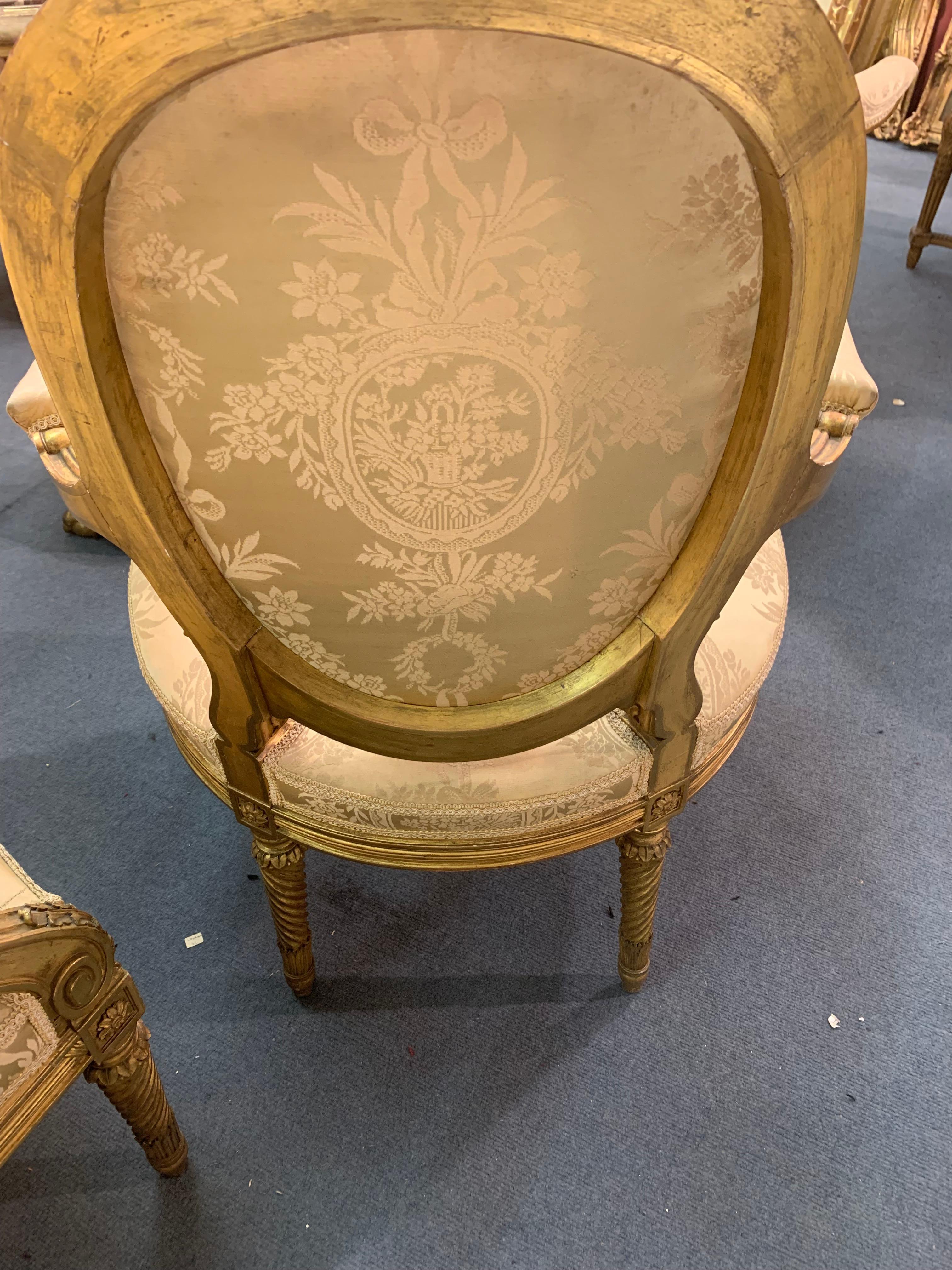 Late 19th Century Salon Set  in Giltwood Comprising Four Armchairs and One Sofa  For Sale