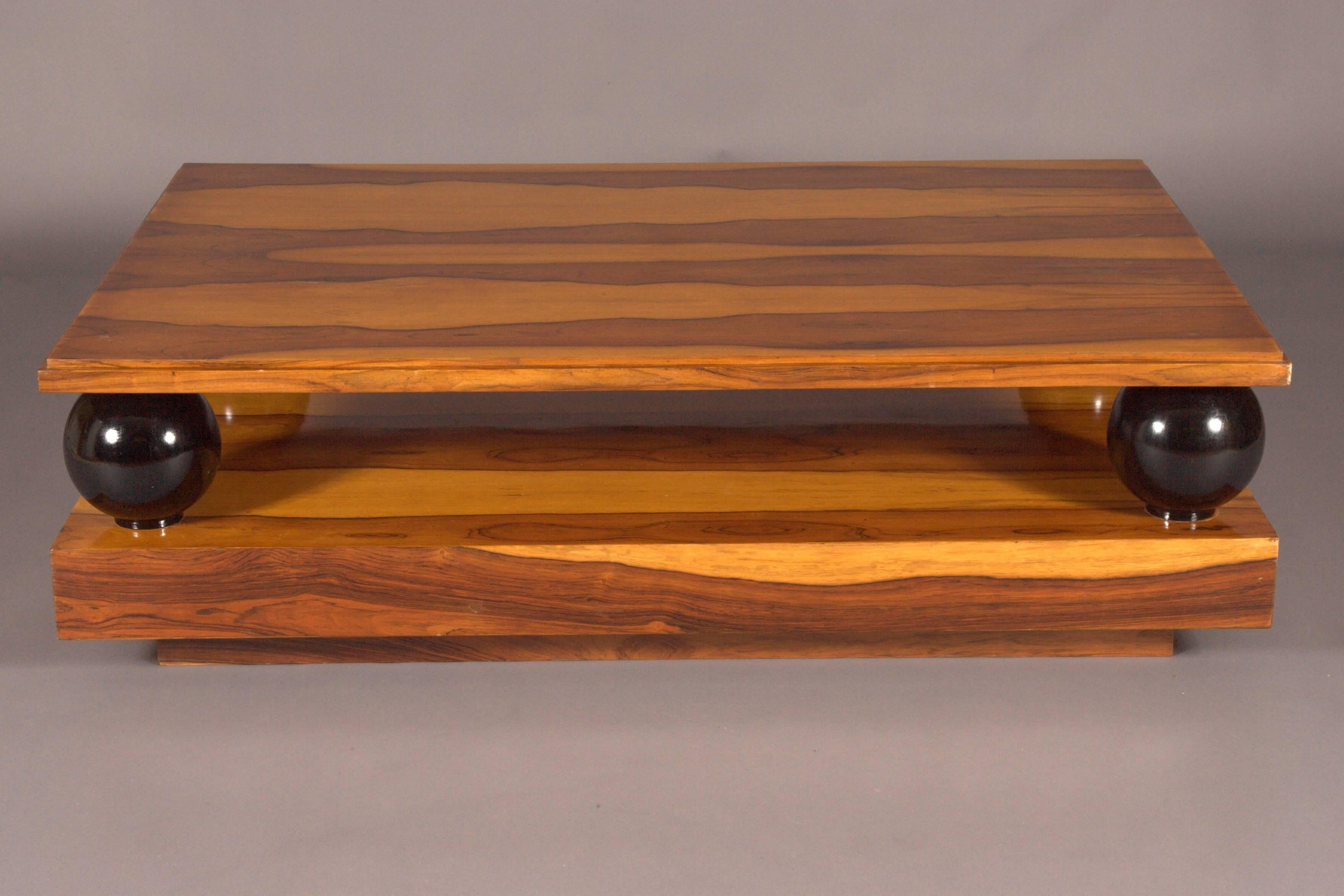exotic Indian rosewood on solid softwood. Four black-colored balls on a rectangular, stepped base plate. Straight frame base for slightly recessed table top. The floor and the table top are beautifully grained. Nice patina, with shellac hand
